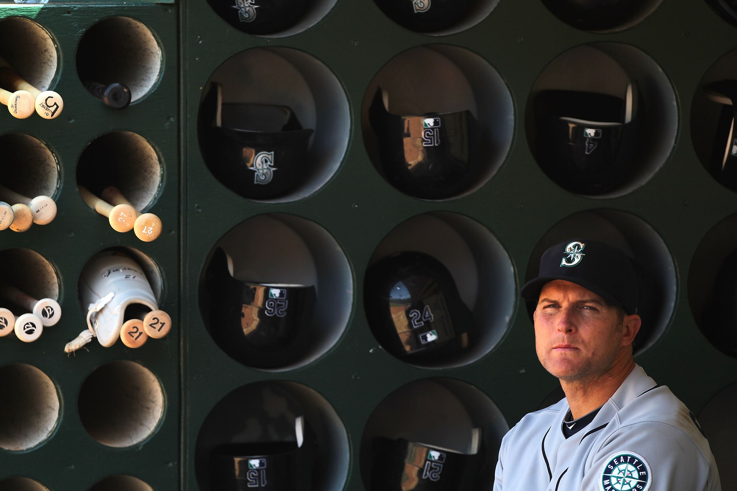 OAKLAND, CA - APRIL 08: Mike Sweeney #5 of the Seattle Mariners looks on from the dugout against the Oakland Athletics during an MLB game at the Oakland-Alameda County Coliseum on April 8, 2010 in Oakland, California. (Photo by Jed Jacobsohn/Getty Images)