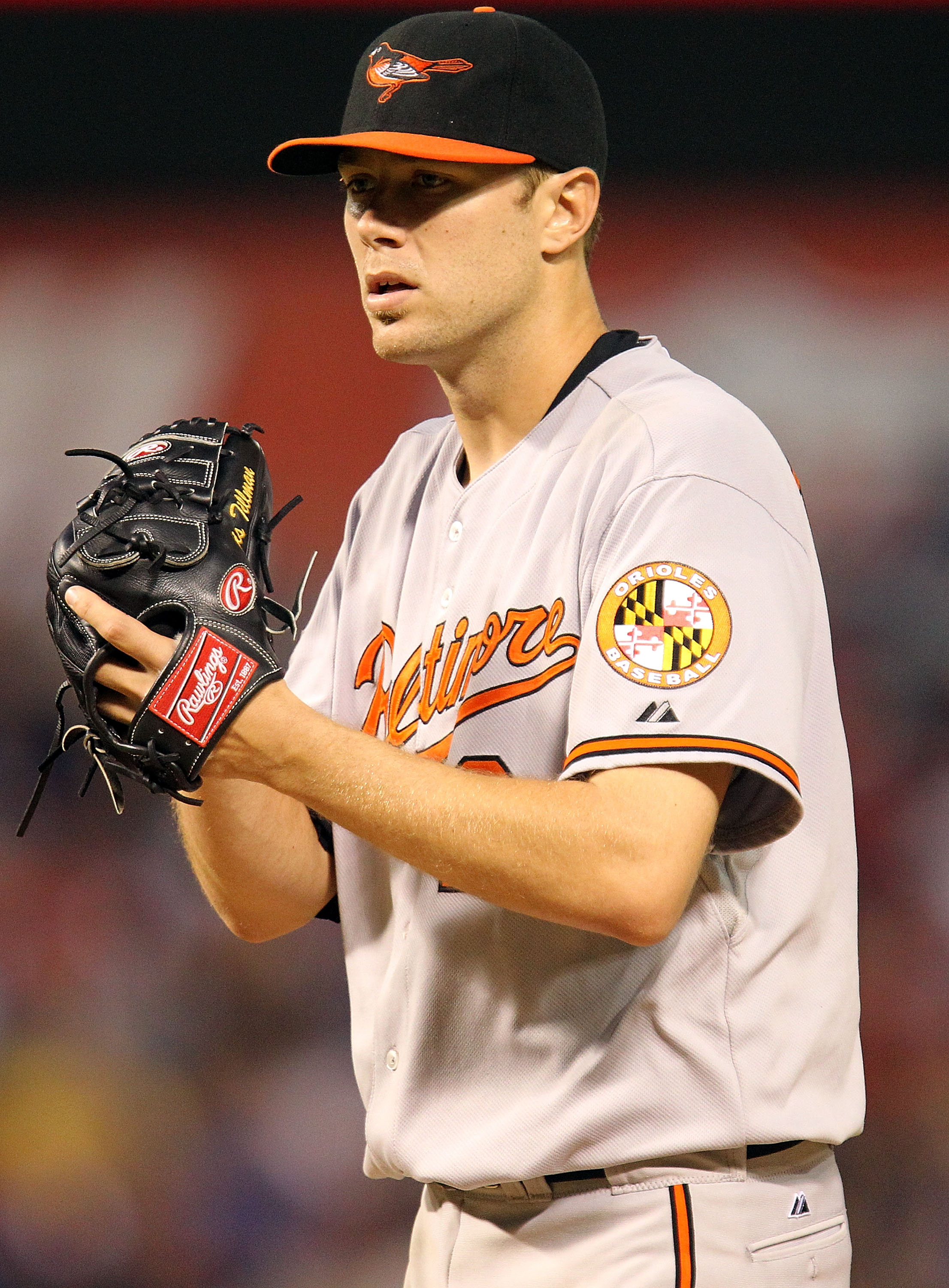 ARLINGTON, TX - JULY 10:  Pitcher Chris Tillman #24 of the Baltimore Orioles throws against the Texas Rangers on July 10, 2010 at Rangers Ballpark in Arlington, Texas.  (Photo by Ronald Martinez/Getty Images)