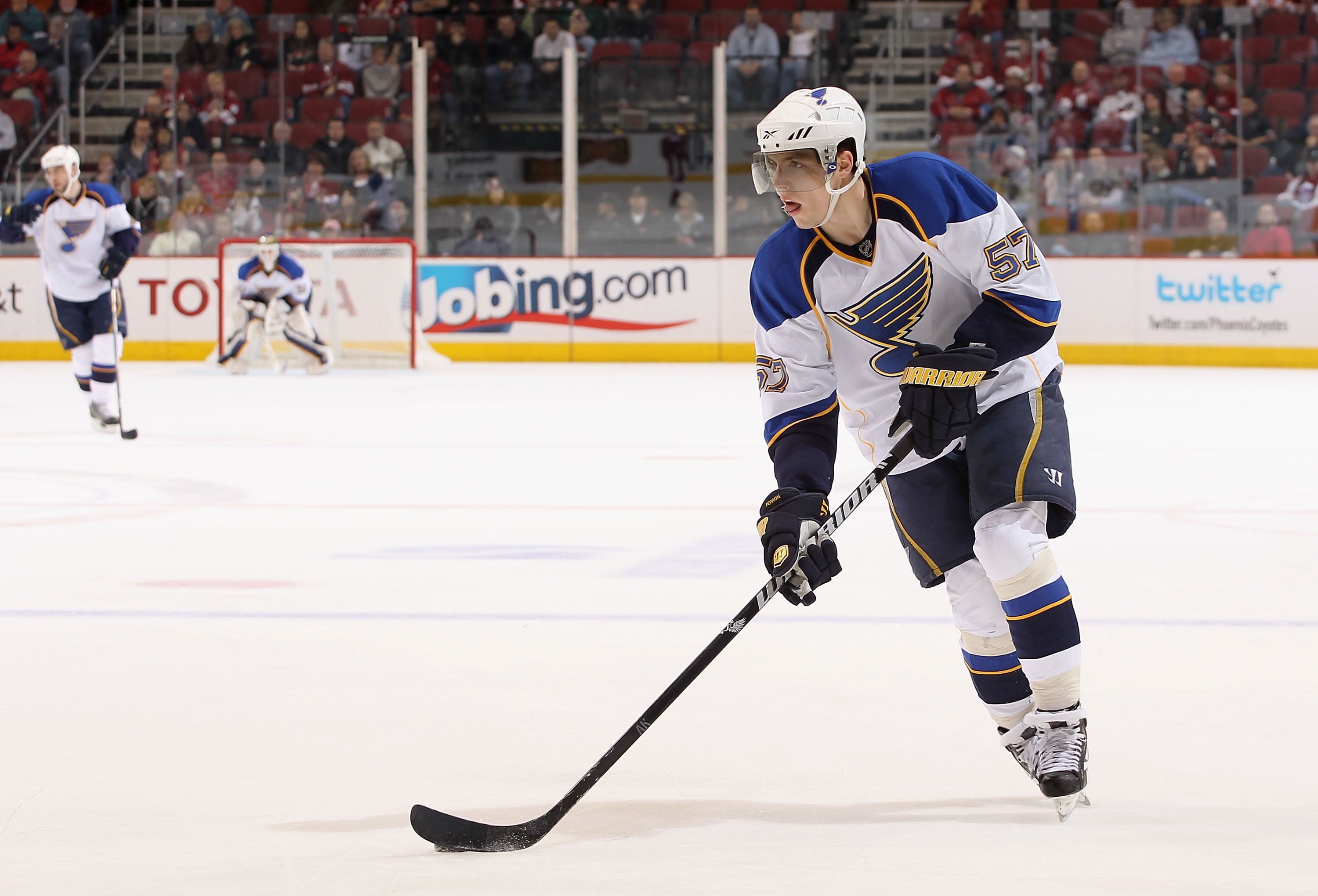 GLENDALE, AZ - MARCH 02:  David Perron #57 of the St. Louis Blues skates with the puck during the NHL game against the Phoenix Coyotes at Jobing.com Arena on March 2, 2010 in Glendale, Arizona. The Blues defeated the Coyotes 5-2.  (Photo by Christian Pete