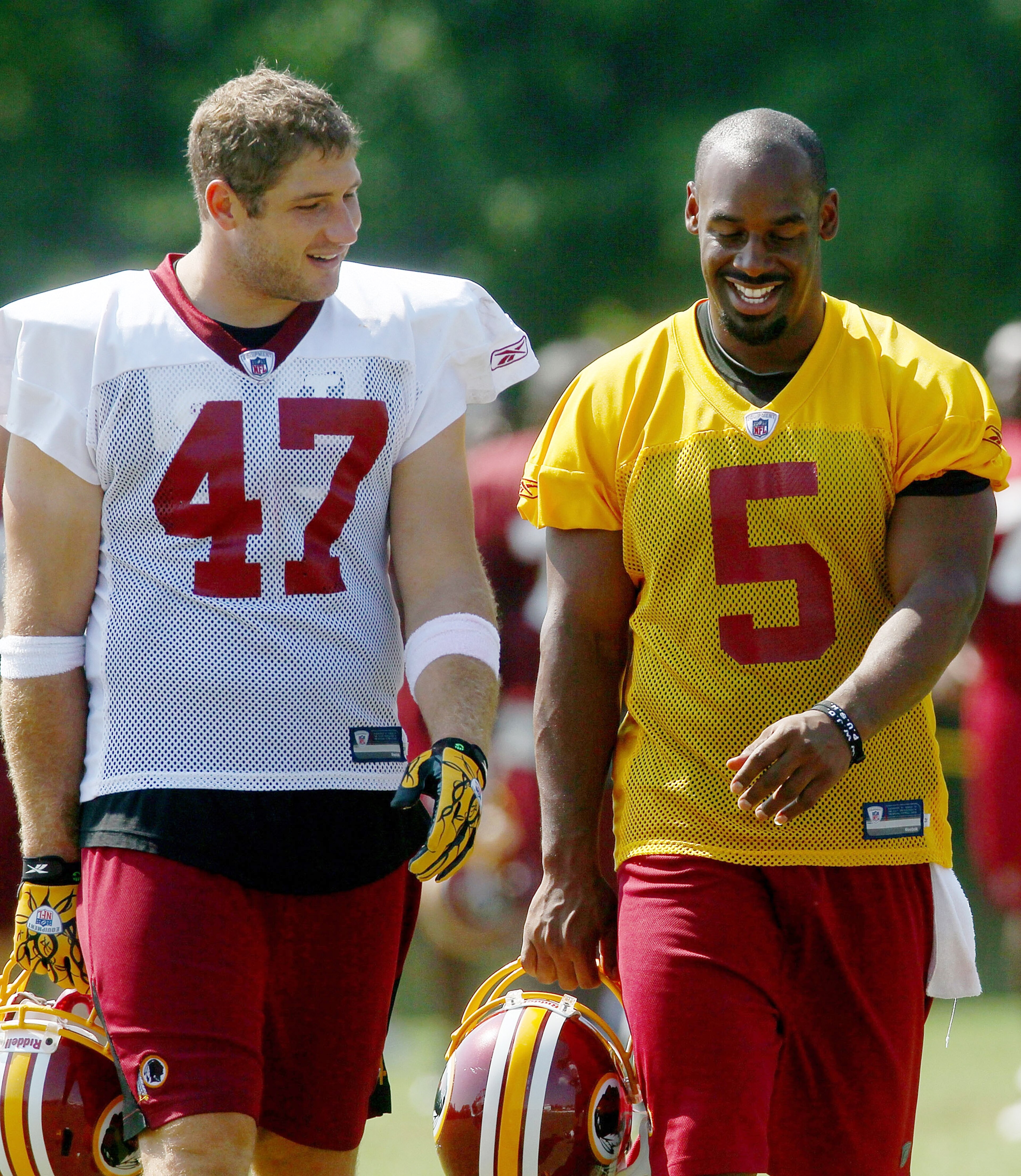 ASHBURN, VA - AUGUST 06:  Quarterback Donovan McNabb #5 of the Washington Redskins and tight end Chris Cooley #47 walk off the field following practice during Redskins training camp on August 6, 2010 in Ashburn, Virginia.  (Photo by Win McNamee/Getty Imag