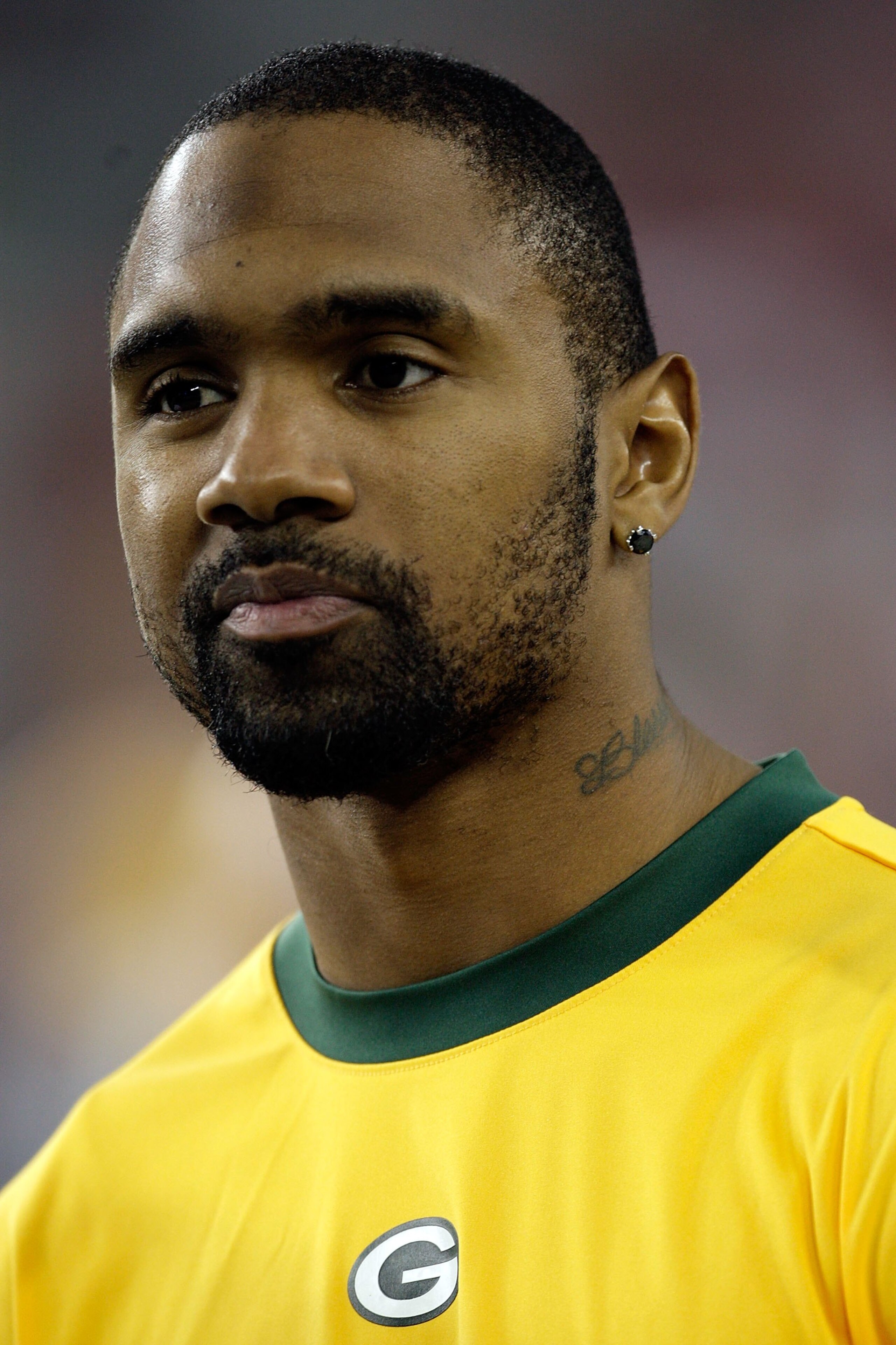 GLENDALE, AZ - JANUARY 03:  Charles Woodson #21 of the Green Bay Packers looks on from the sideline in the second half against the Arizona Cardinals at University of Phoenix Stadium on January 3, 2010 in Glendale, Arizona.  (Photo by Jamie Squire/Getty Im
