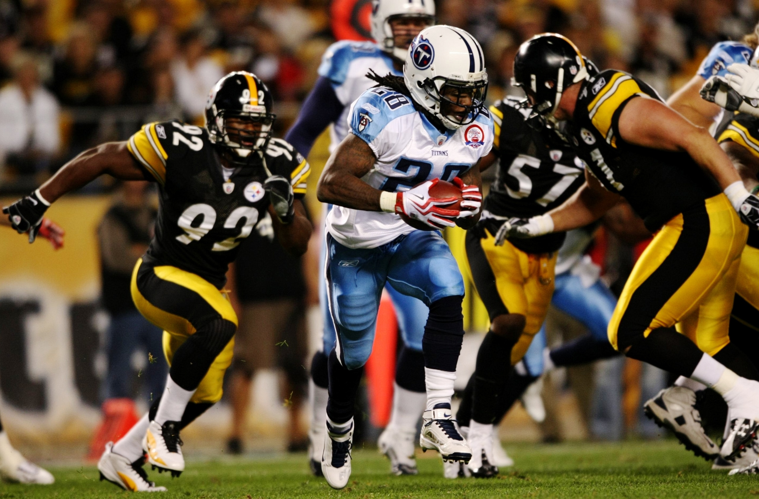 PITTSBURGH - SEPTEMBER 10:  Runningback Chris Johnson #28 of the Tennessee Titans carries the ball during the first quarter of the NFL season opener against the Pittsburgh Steelers at Heinz Field on September 10, 2009 in Pittsburgh, Pennsylvania. (Photo b