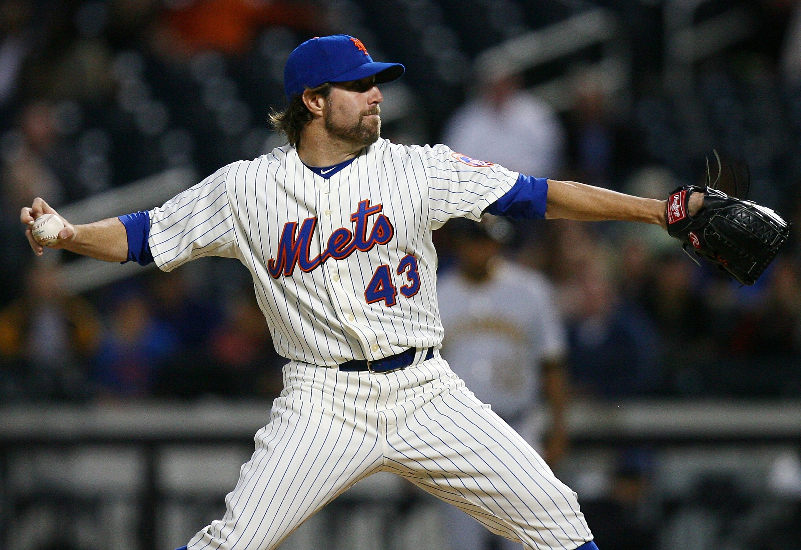 NEW YORK - SEPTEMBER 14:  R.A. Dickey #43 of the New York Mets pitches against the Pittsburgh Pirates on September 14, 2010 at Citi Field in the Flushing neighborhood of the Queens borough of New York City.  (Photo by Andrew Burton/Getty Images)