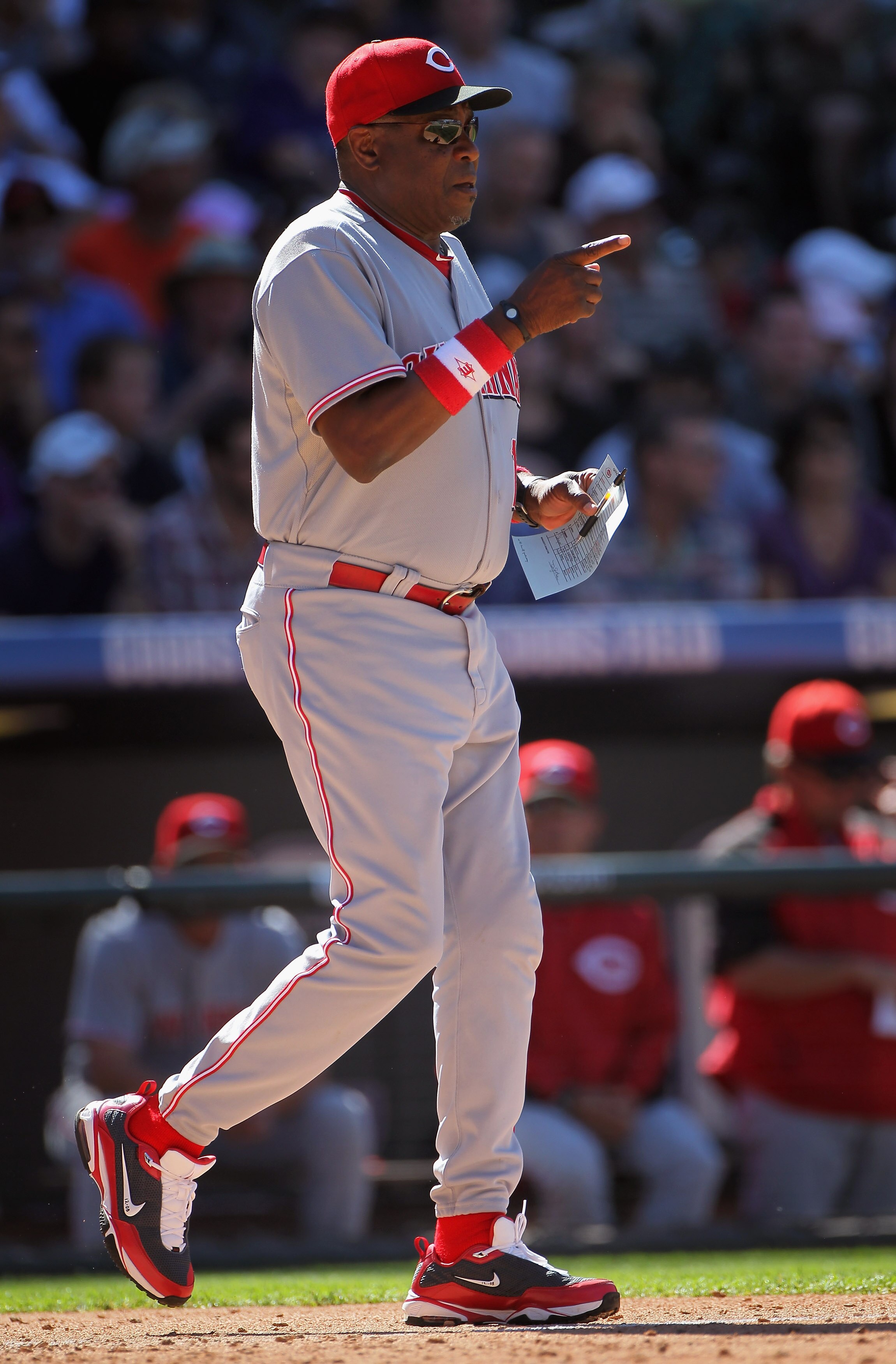 DENVER - SEPTEMBER 06:  Manager Dusty Baker #12 of the Cincinnati Reds heads to the mound to put pitcher Aroldis Chapman into the game against the Colorado Rockies at Coors Field on September 6, 2010 in Denver, Colorado. The Rockies defeated the Reds 10-5