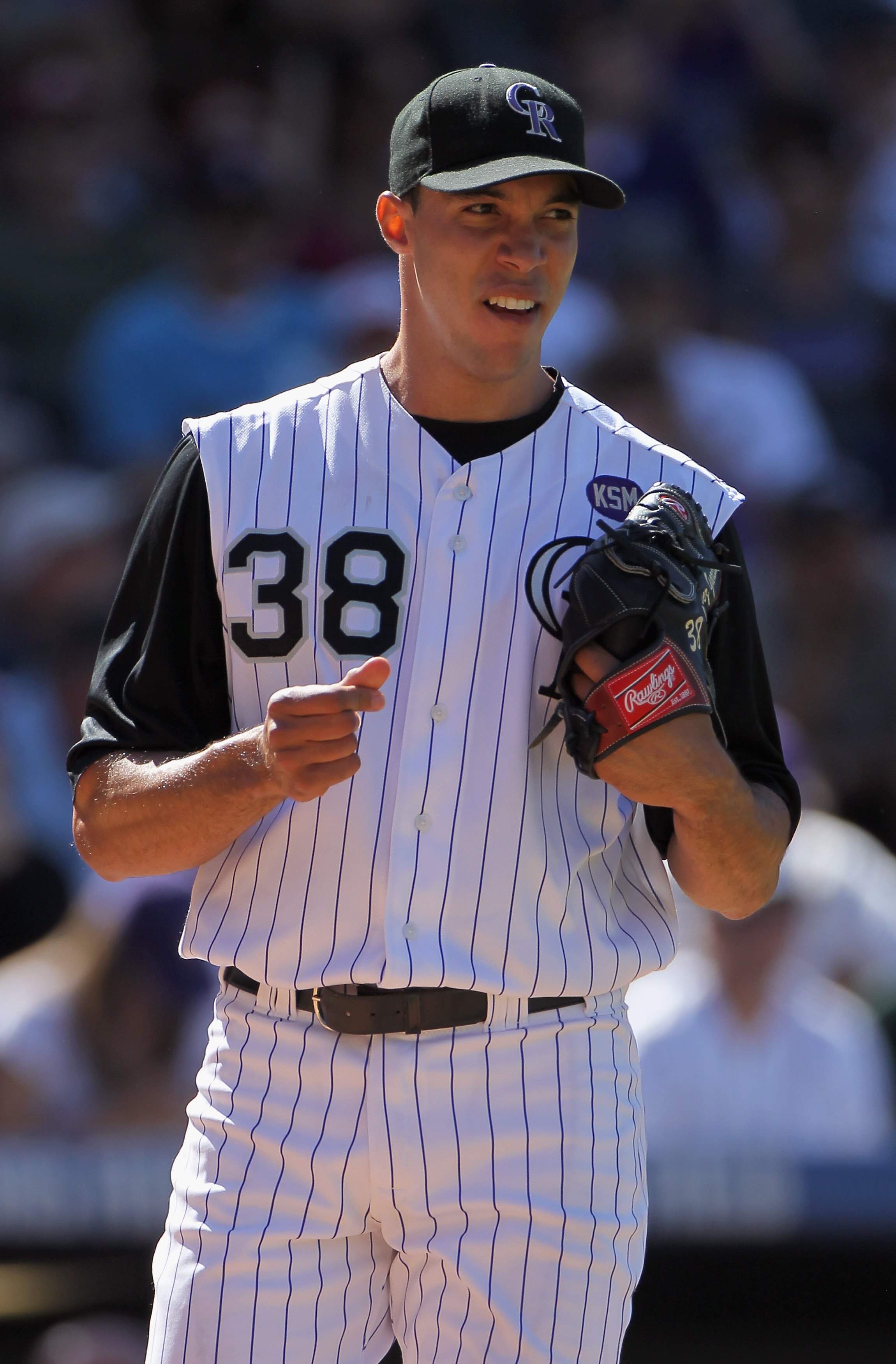 DENVER - SEPTEMBER 06:  Starting pitcher Ubaldo Jimenez #38 of the Colorado Rockies works against the Cincinnati Reds at Coors Field on September 6, 2010 in Denver, Colorado. The Rockies defeated the Reds 10-5 as Jimenez earned a club record 18th victory 