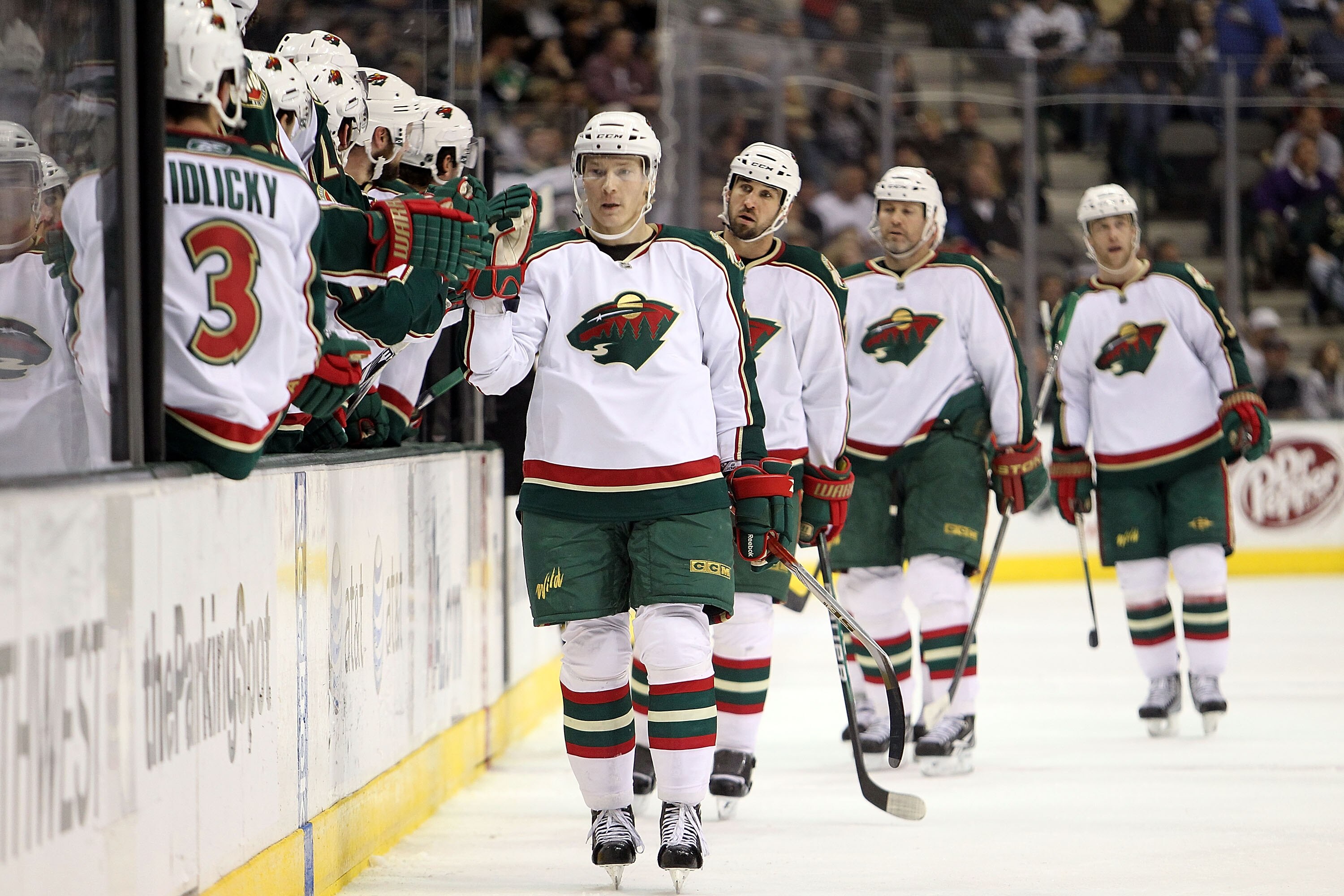 DALLAS - JANUARY 18:  Right wing Antti Miettinen #20 of the Minnesota Wild celebrate a goal against the Dallas Stars at American Airlines Center on January 18, 2010 in Dallas, Texas.  (Photo by Ronald Martinez/Getty Images)