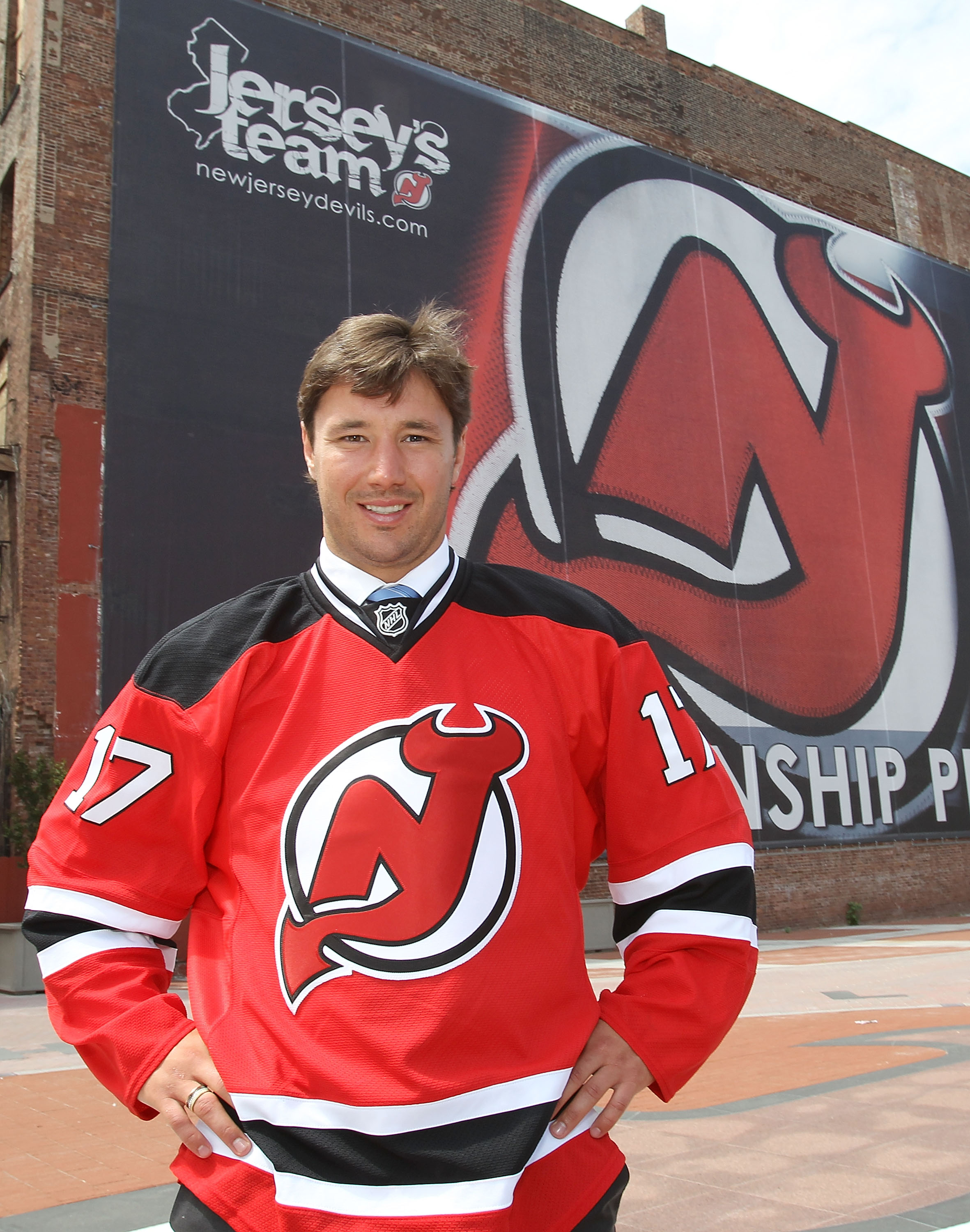 NEWARK, NJ - JULY 20:  Ilya Kovalchuk of the New Jersey Devils poses for photographs following the media opportunity announcing his contract renewal at the Prudential Center on July 20, 2010 in Newark, New Jersey.  (Photo by Bruce Bennett/Getty Images)