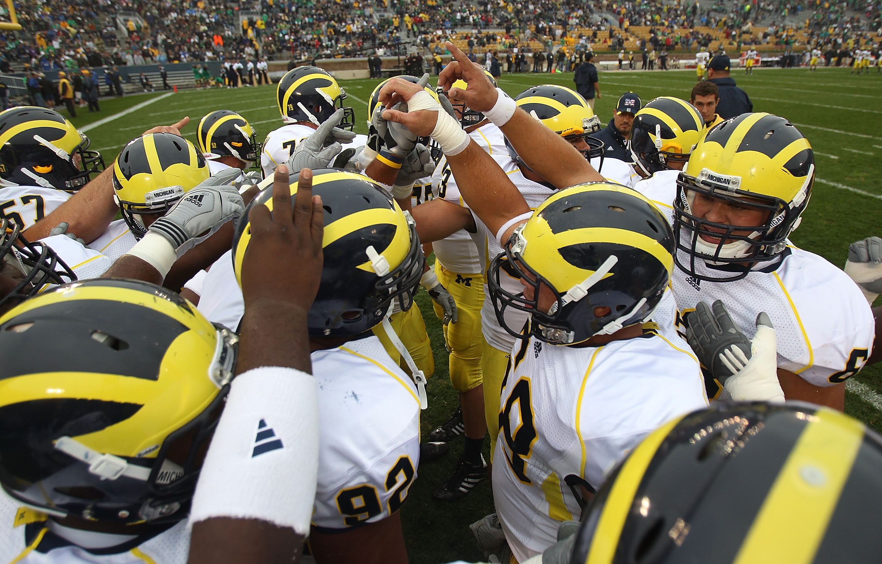 SOUTH BEND, IN - SEPTEMBER 11: Members of the Michigan Wolverines get ready during warm-ups to play against the Notre Dame Fighting Irish at Notre Dame Stadium on September 11, 2010 in South Bend, Indiana. Michigan defeated Notre Dame 28-24.  (Photo by Jo
