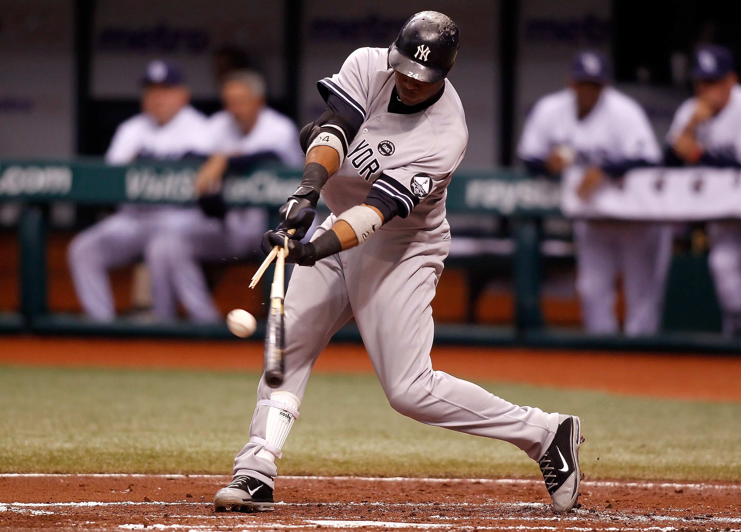ST PETERSBURG, FL - SEPTEMBER 14:  Infielder Robinson Cano #24 of the New York Yankees breaks his bat against the Tampa Bay Rays during the game at Tropicana Field on September 14, 2010 in St. Petersburg, Florida.  (Photo by J. Meric/Getty Images)