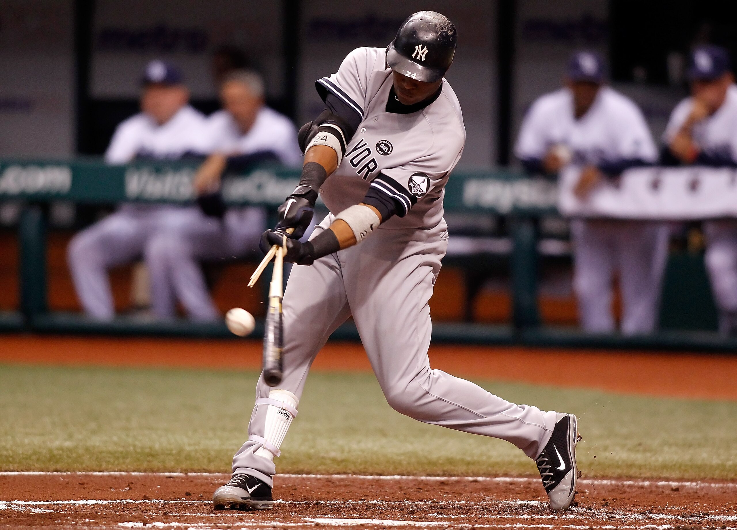 ST PETERSBURG, FL - SEPTEMBER 14:  Infielder Robinson Cano #24 of the New York Yankees breaks his bat against the Tampa Bay Rays during the game at Tropicana Field on September 14, 2010 in St. Petersburg, Florida.  (Photo by J. Meric/Getty Images)
