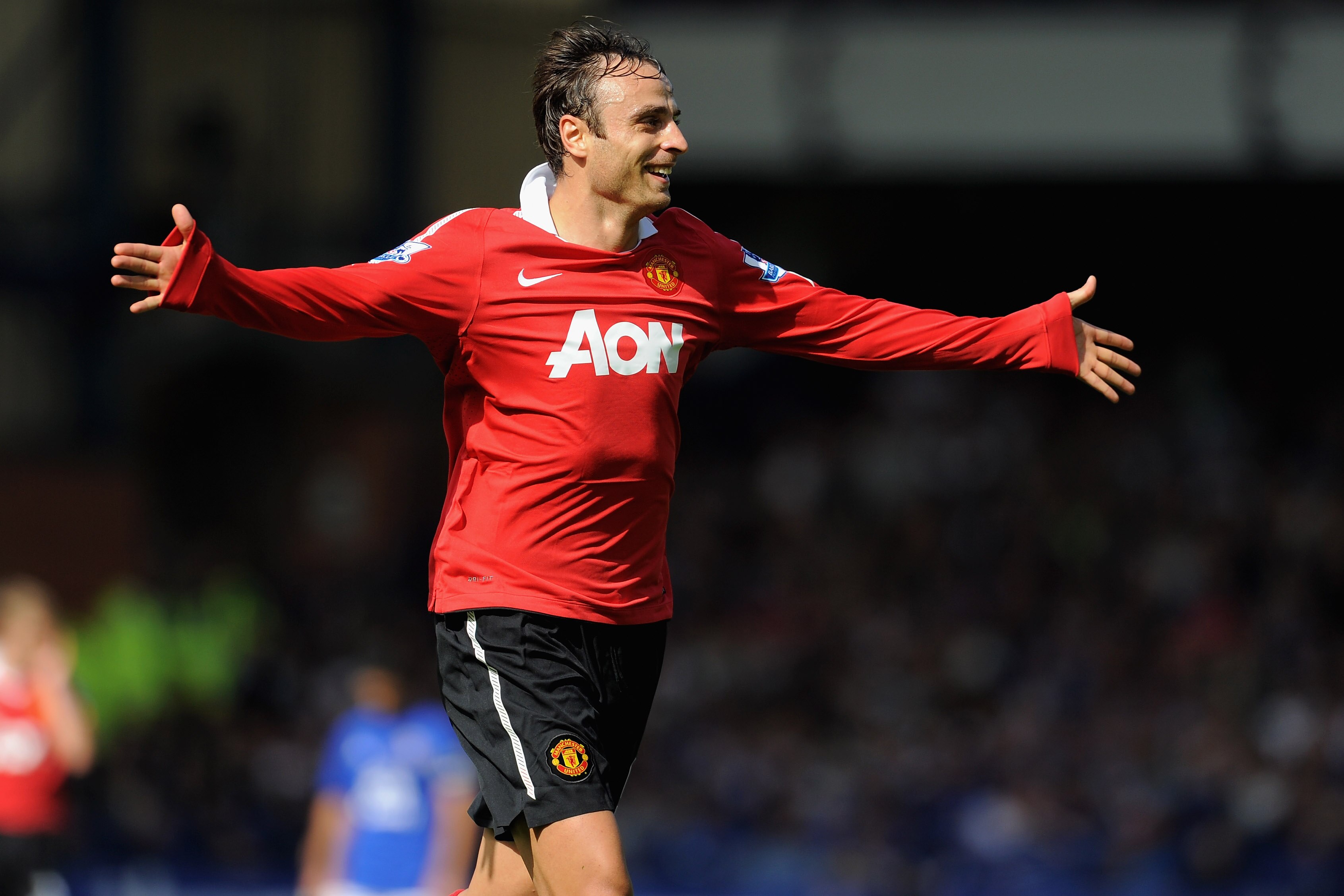 LIVERPOOL, ENGLAND - SEPTEMBER 11:  Dimitar Berbatov of Manchester United celebrates scoring to make it 3-1 during the Barclays Premier League match between Everton and Manchester United at Goodison Park on September 11, 2010 in Liverpool, England.  (Phot