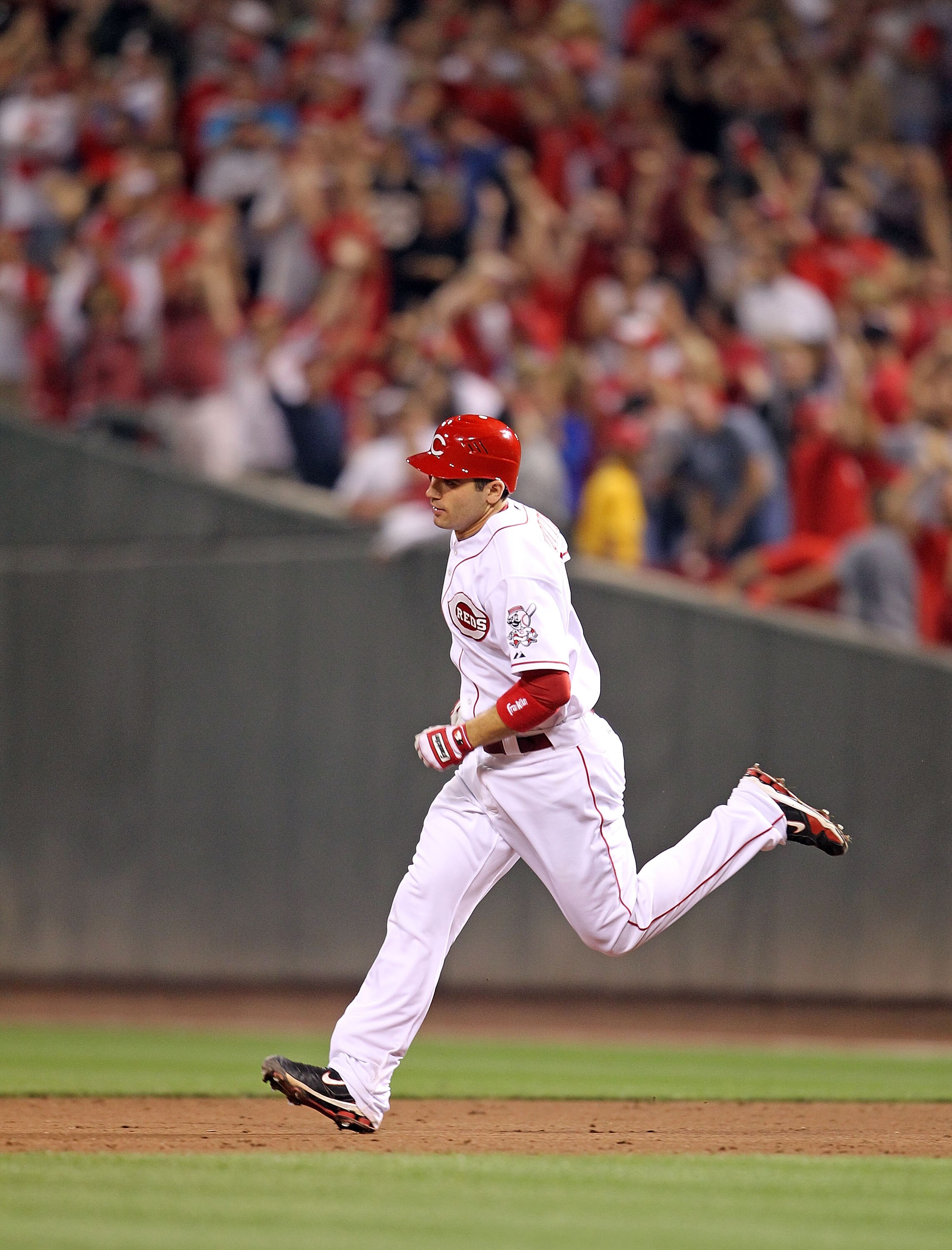 CINCINNATI - SEPTEMBER 11:  Joey Votto #19 of the Cincinnati Reds runs the bases after hitting a game winning home run during the game against the Pittsburg Pirates at Great American Ball Park on September 11, 2010 in Cincinnati, Ohio. The Reds won 5-4  (