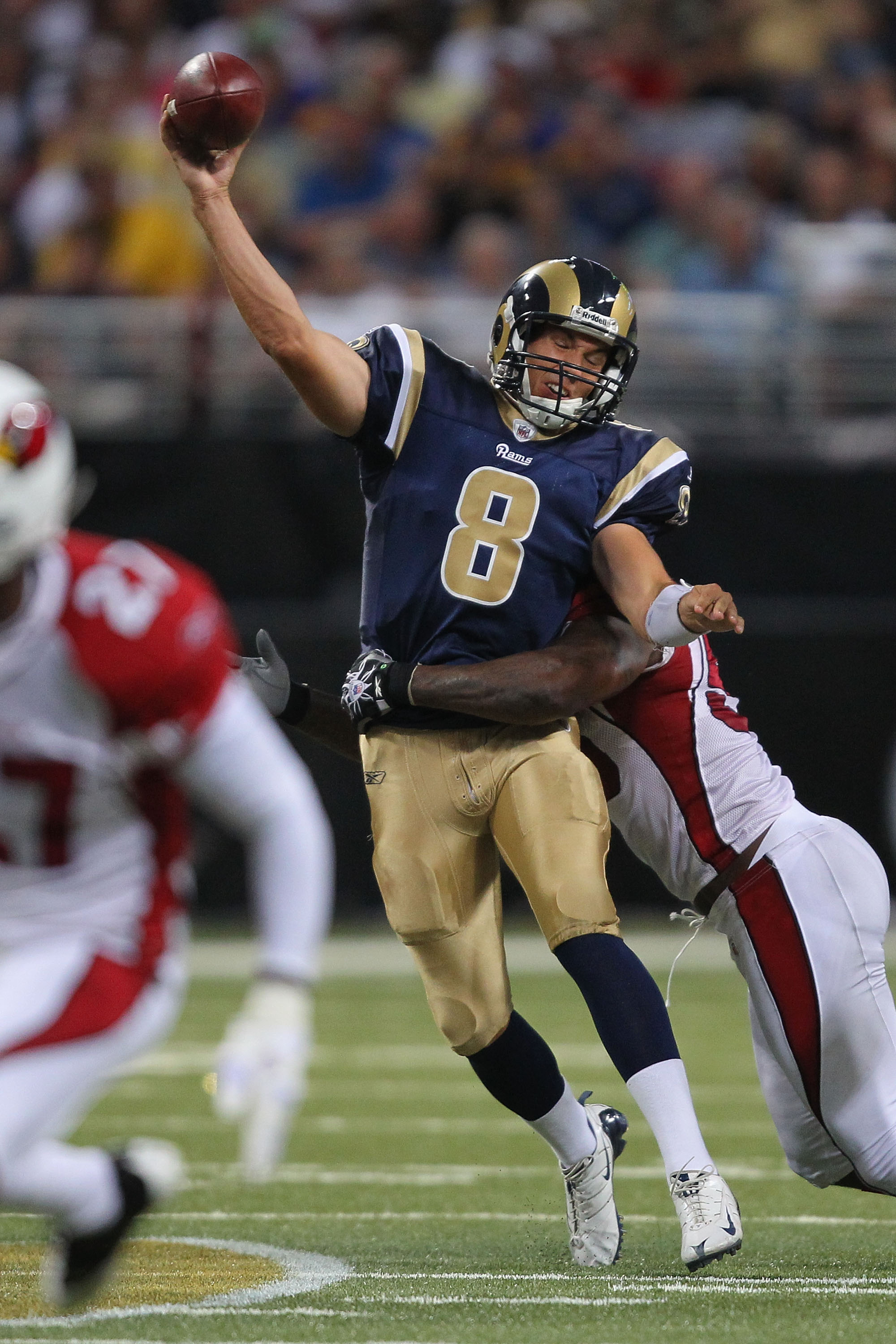 ST. LOUIS - SEPTEMBER 12: Sam Bradford #8 of the St. Louis Rams is sacked against the Arizona Cardinals during the NFL season opener at the Edward Jones Dome on September 12, 2010 in St. Louis, Missouri.  The Cardinals beat the Rams 17-13.  (Photo by Dili