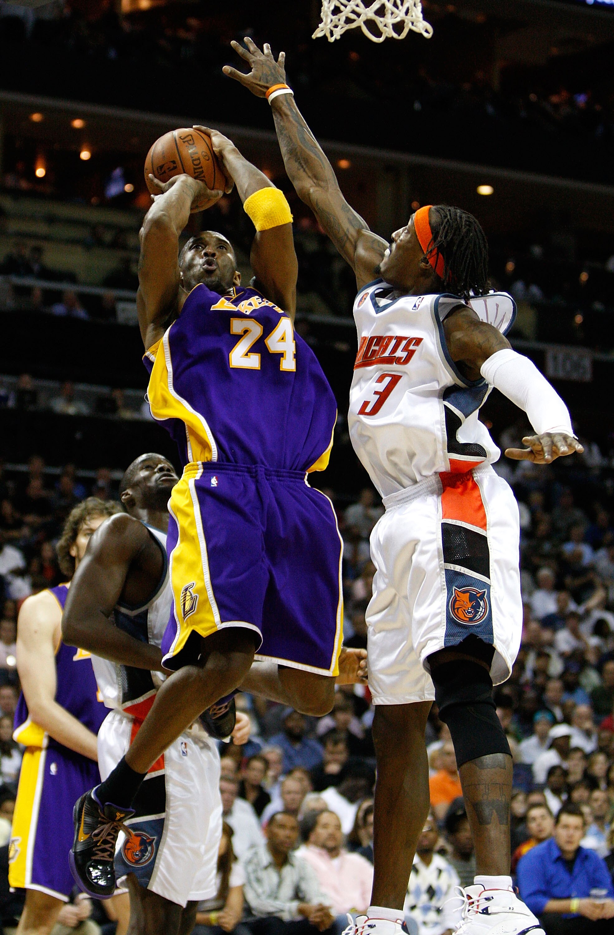 CHARLOTTE, NC - MARCH 31:  Kobe Bryant #24 of the Los Angeles Lakers shoots the ball over Gerald Wallace #3 of the Charlotte Bobcats during their game at Time Warner Cable Arena on March 31, 2009 in Charlotte, North Carolina.  NOTE TO USER: User expressly
