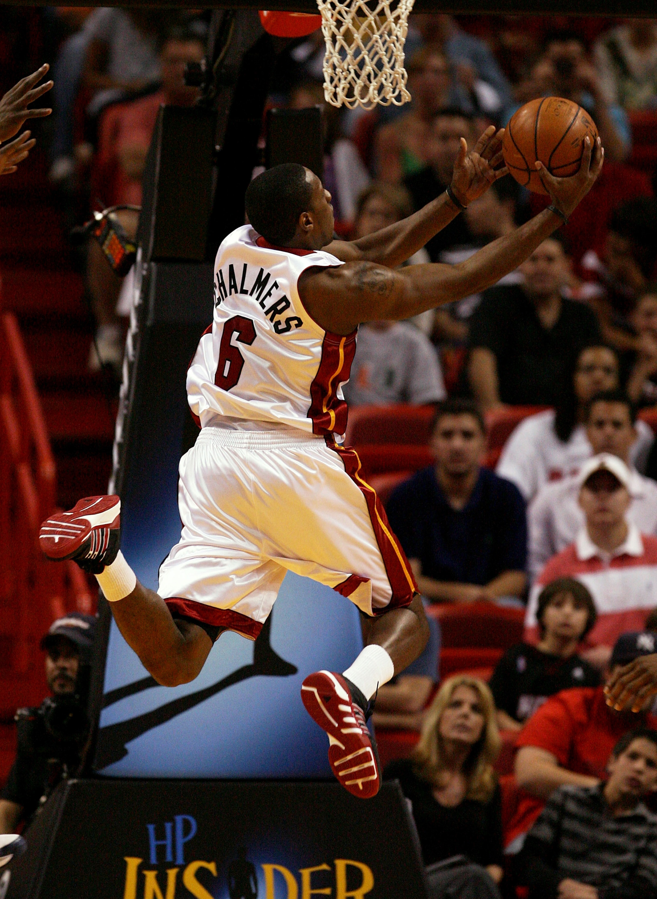 MIAMI - DECEMBER 30:  Mario Chalmers #6 of the Miami Heat drives against the Cleveland Cavaliers at American Airlines Arena on December 30, 2008 in Miami, Florida. NOTE TO USER: User expressly acknowledges and agrees that, by downloading and/or using this