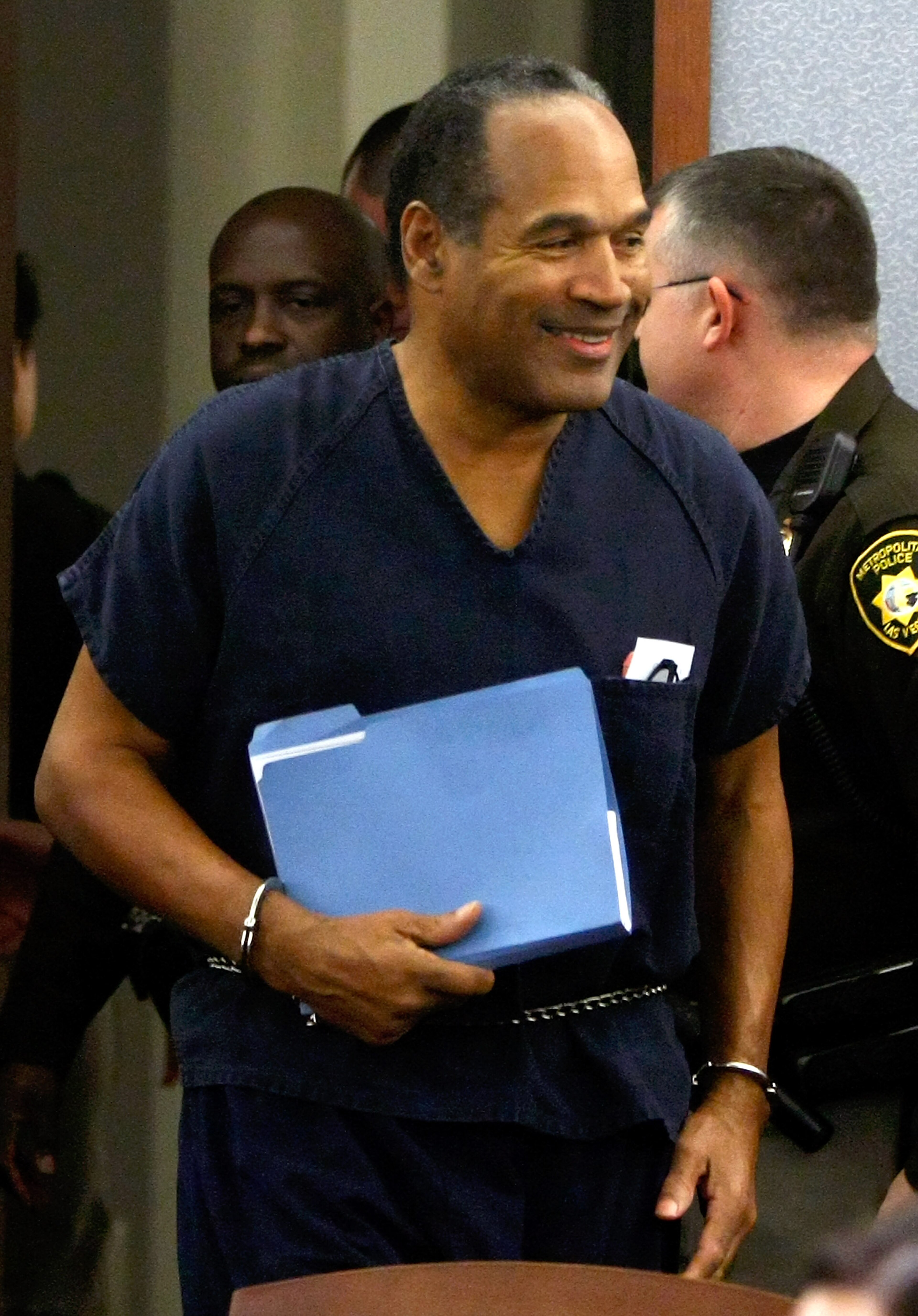 LAS VEGAS - DECEMBER 05: O.J. Simpson smiles as he arrives in court for his sentencing hearing at the Clark County Regional Justice Center December 5, 2008 in Las Vegas, Nevada. Simpson and co-defendant Clarence 'C.J.' Stewart were sentenced on 12 charge LAS VEGAS - DECEMBER 05: O.J. Simpson smiles as he arrives in court for his sentencing hearing at the Clark County Regional Justice Center December 5, 2008 in Las Vegas, Nevada. Simpson and co-defendant Clarence 'C.J.' Stewart were sentenced on 12 charge