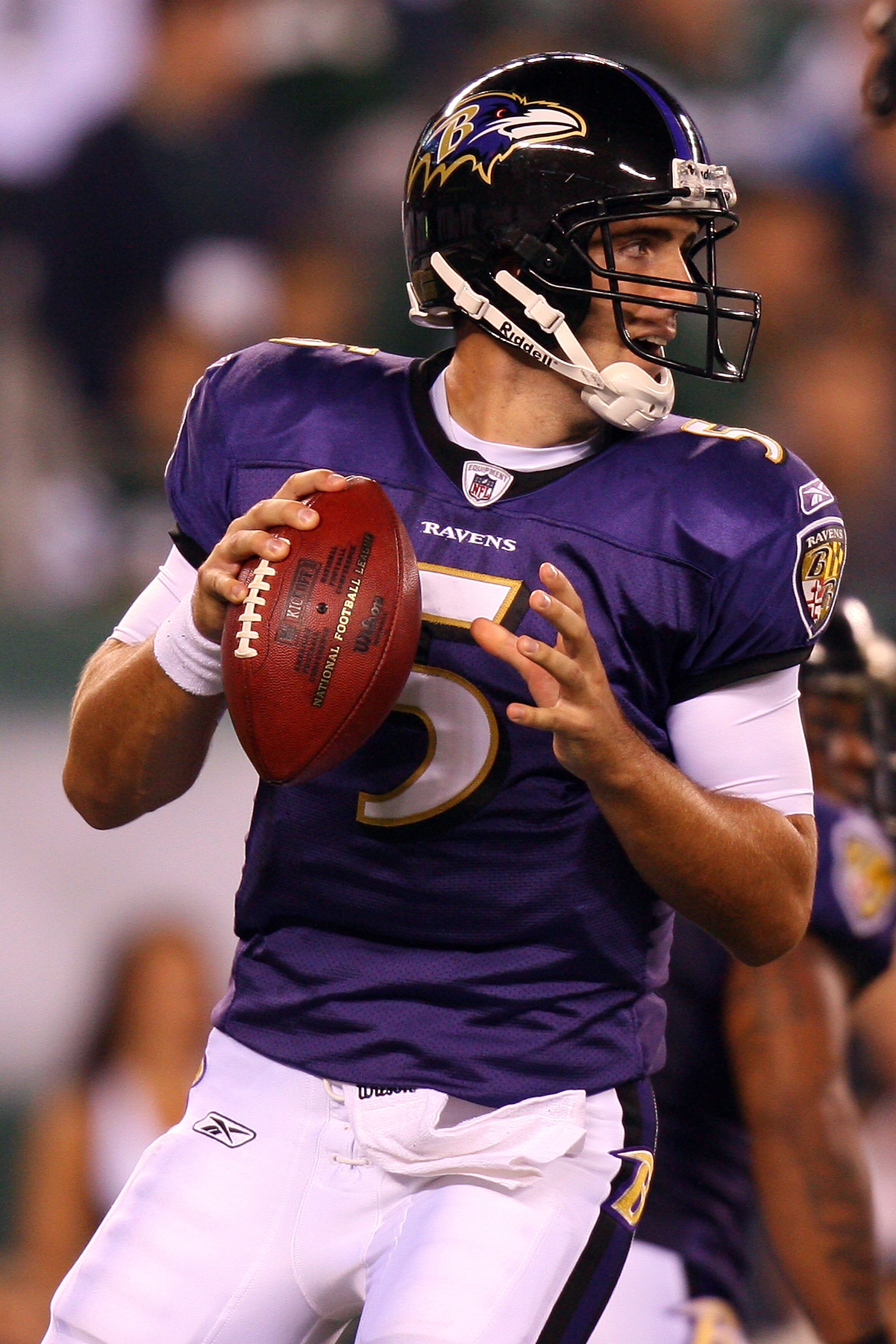 EAST RUTHERFORD, NJ - SEPTEMBER 13:  Joe Flacco #5 of the Baltimore Ravens looks to throws a pass against the New York Jets during the home opener at the New Meadowlands Stadium on September 13, 2010 in East Rutherford, New Jersey.  (Photo by Andrew Burto