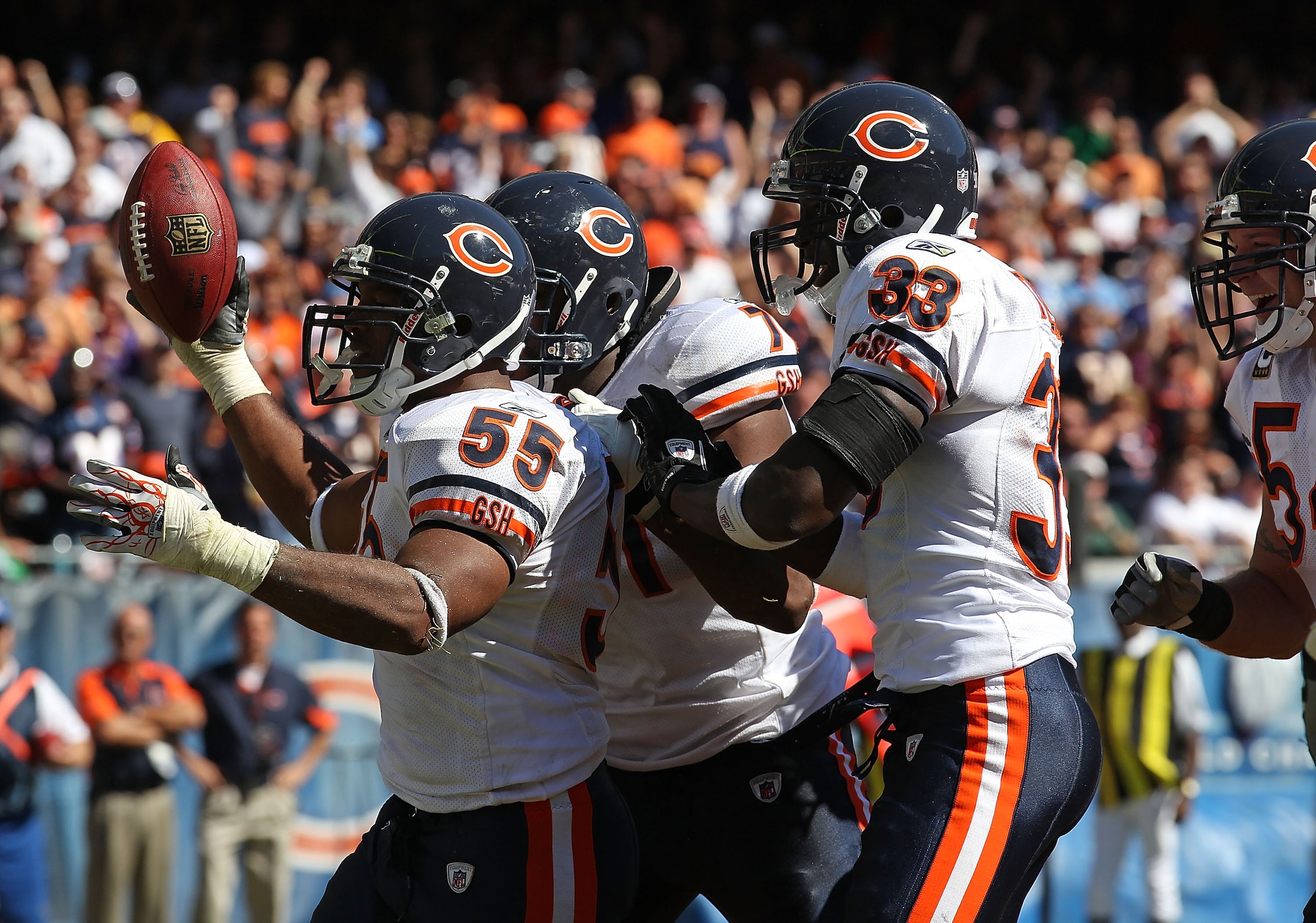 CHICAGO - SEPTEMBER 12: Lance Briggs #55 of the Chicago Bears celebrates a turn-over with teammates Israel Idonije #71 and Charles Tillman #33 during the NFL season opening game against the Detroit Lions at Soldier Field on September 12, 2010 in Chicago, 