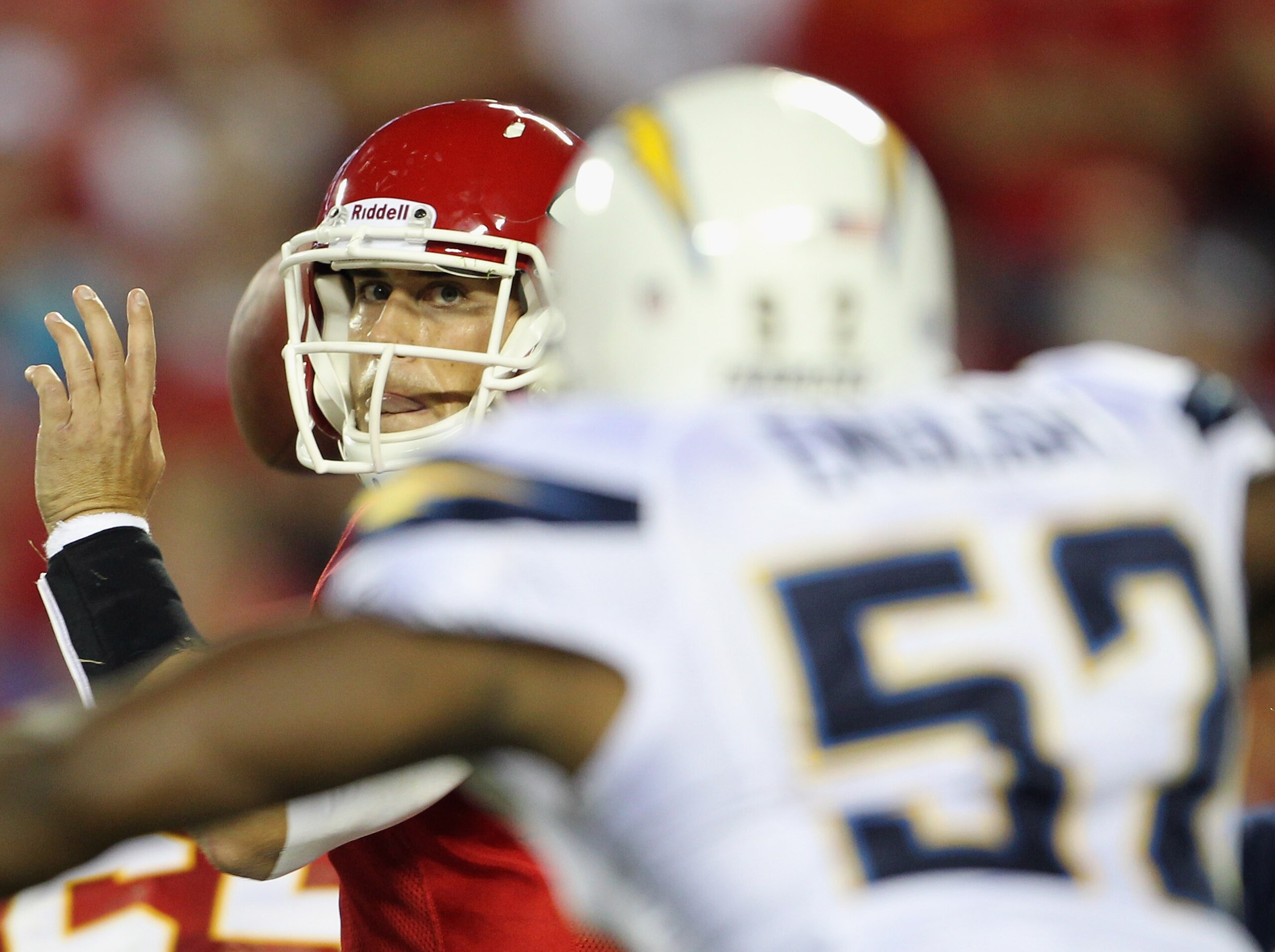KANSAS CITY, MO - SEPTEMBER 13:  Quarterback Matt Cassel #7 of the Kansas City Chiefs passes as he is rushed by Larry English #52 of the San Diego Chargers during the 1st quarter of the game against on September 13, 2010 at Arrowhead Stadium in Kansas Cit