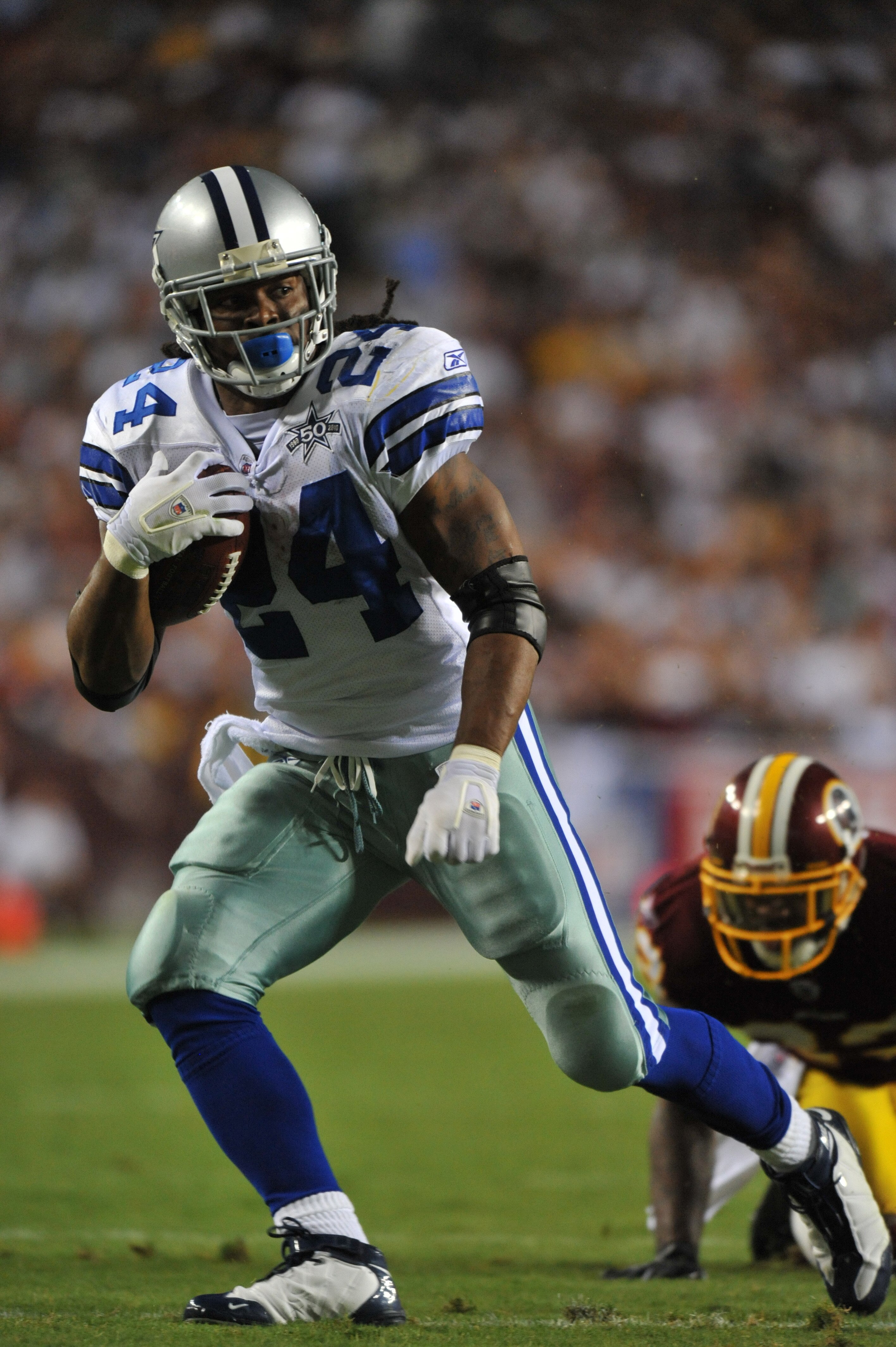 LANDOVER - SEPTEMBER 12:  Marion Barber #24 of the Dallas Cowboys runs the ball during the NFL season opener against the Washington Redskins at FedExField on September 12, 2010 in Landover, Maryland. The Redskins defeated the Cowboys 13-7. (Photo by Larry
