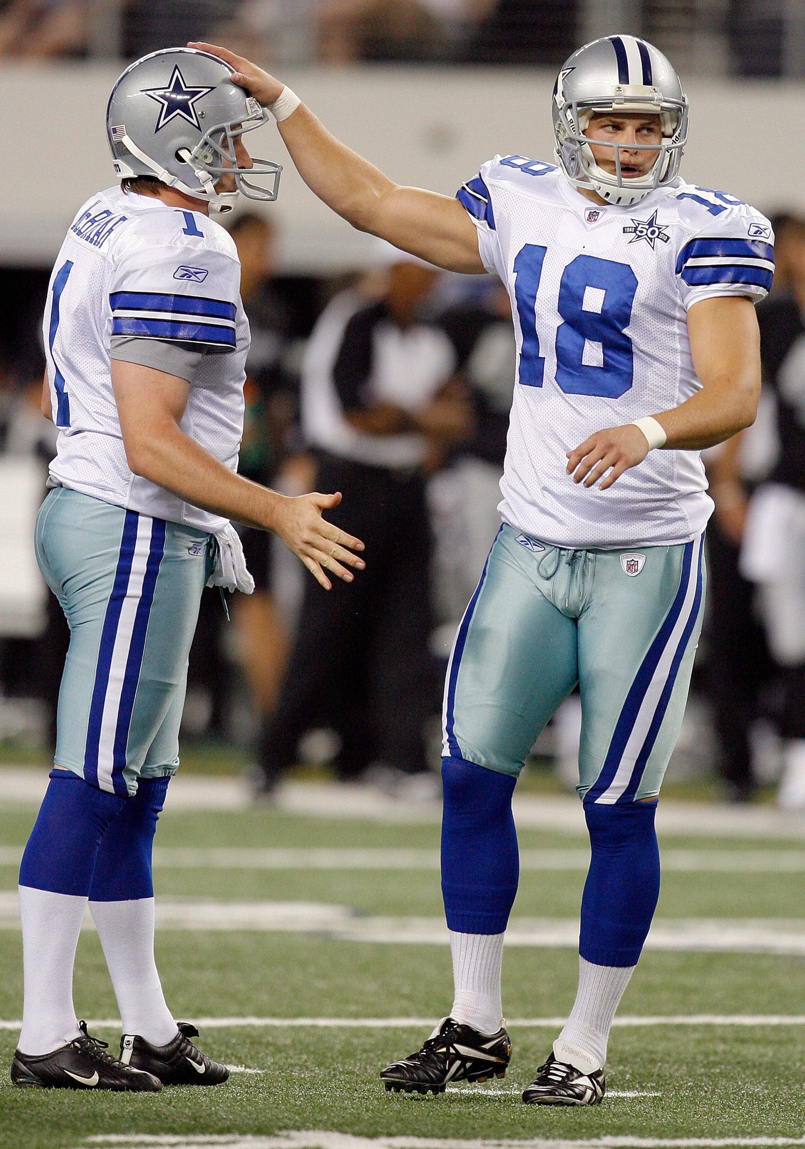 ARLINGTON, TX - AUGUST 12:  David Buehler #18 of the Dallas Cowboys celebrates with Mat McBriar #1 after Buehler kicked a field goal against the Oakland Raiders in the preseason game at Dallas Cowboys Stadium on August 12, 2010 in Arlington, Texas.  (Phot
