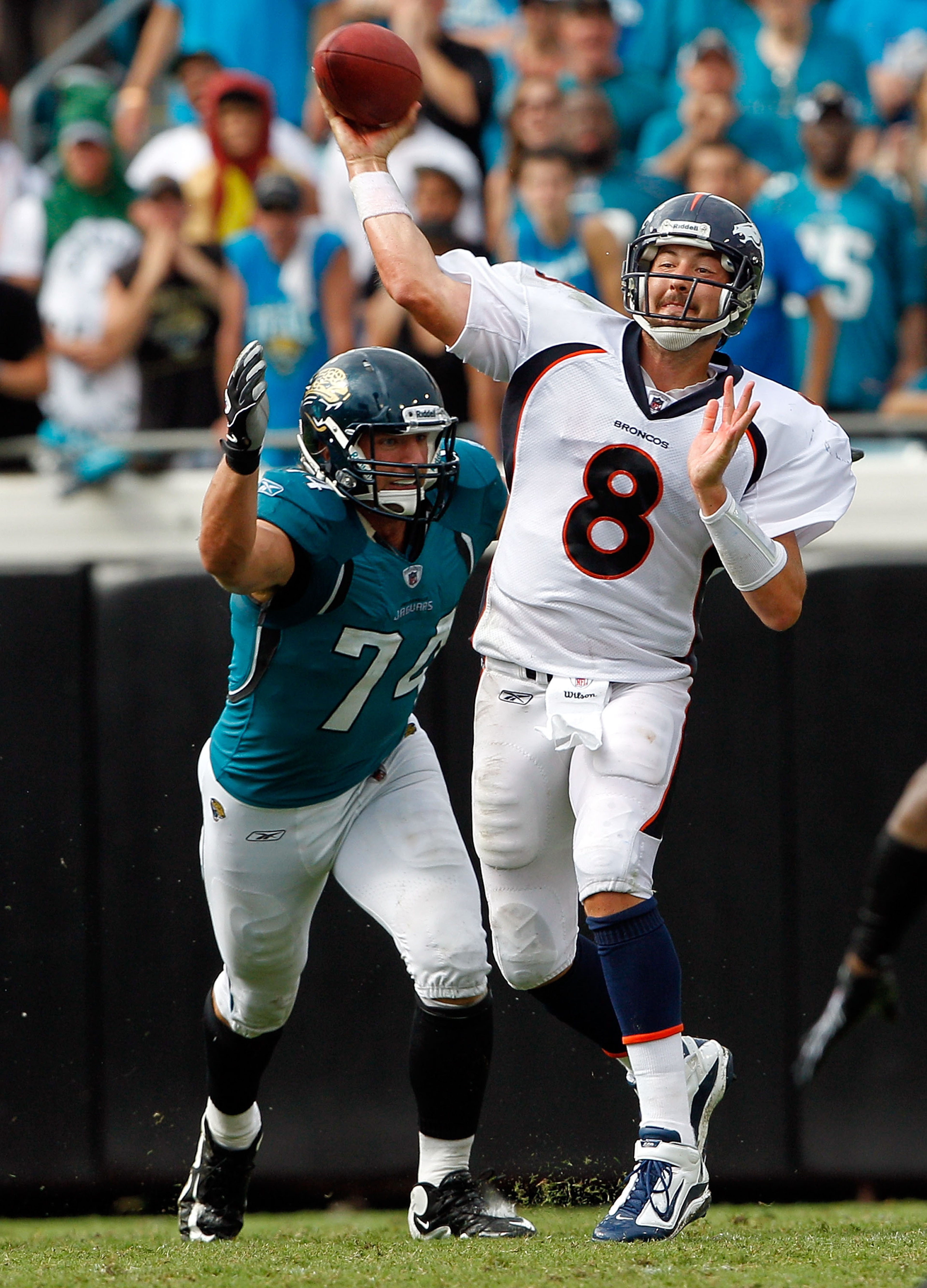 JACKSONVILLE, FL - SEPTEMBER 12:   Aaron Kampman #74 of the Jacksonville Jaguars pressure Kyle Orton #8 of the Denver Broncos during the NFL season opener game at EverBank Field on September 12, 2010 in Jacksonville, Florida.  (Photo by Sam Greenwood/Gett