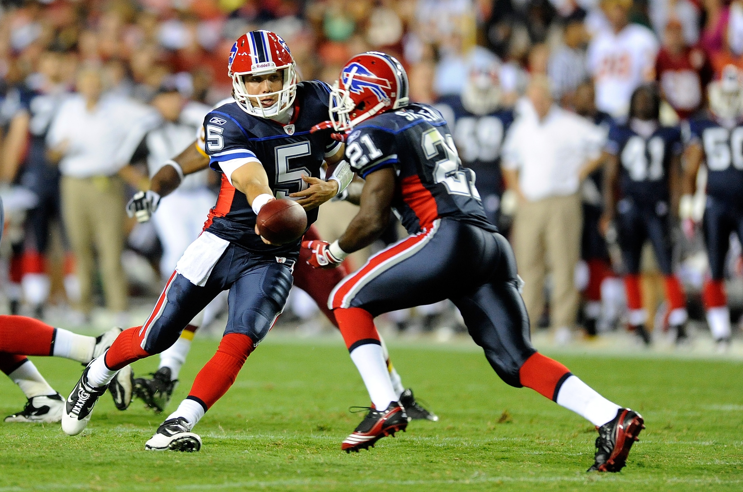 LANDOVER, MD - AUGUST 13:  Trent Edwards #5 of the Buffalo Bills hands the ball off to C.J. Spiller #21 during the preseason game against the Washington Redskins at FedEx Field on August 13, 2010 in Landover, Maryland.  (Photo by Greg Fiume/Getty Images)