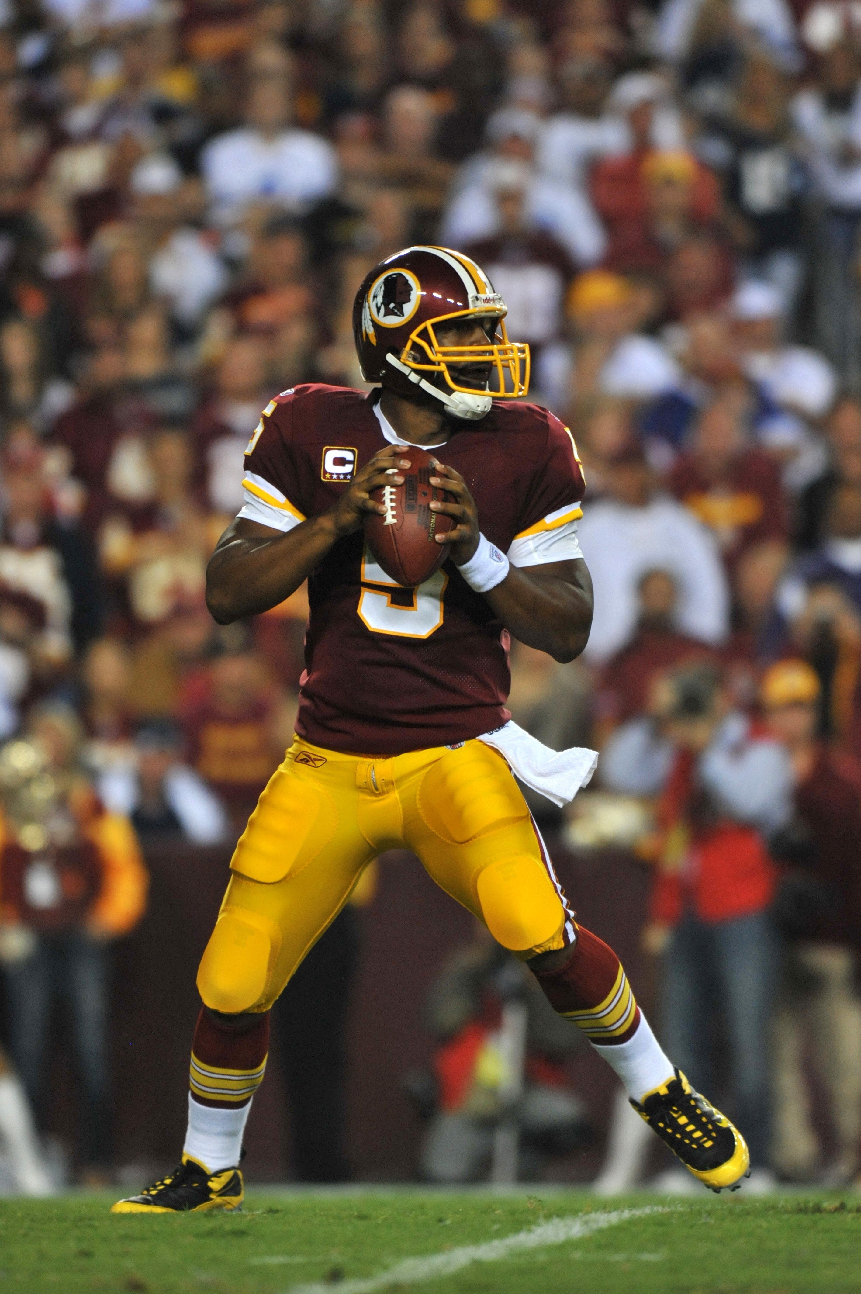 LANDOVER - SEPTEMBER 12: Donovan McNabb #5 of the Washington Redskins passes during the NFL season opener against the Dallas Cowboys at FedExField on September 12, 2010 in Landover, Maryland. The Redskins defeated the Cowboys 13-7. (Photo by Larry French LANDOVER - SEPTEMBER 12: Donovan McNabb #5 of the Washington Redskins passes during the NFL season opener against the Dallas Cowboys at FedExField on September 12, 2010 in Landover, Maryland. The Redskins defeated the Cowboys 13-7. (Photo by Larry French