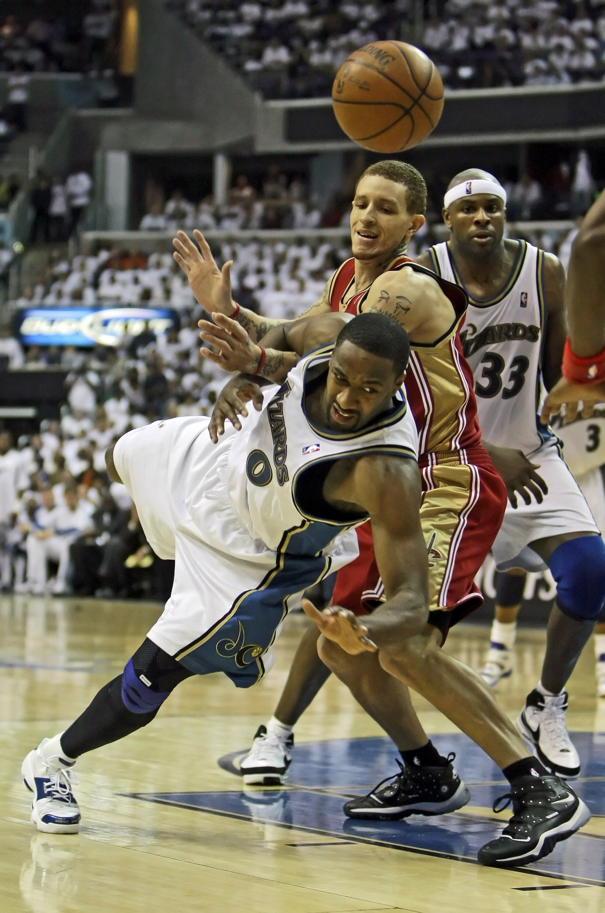 WASHINGTON - APRIL 27: Gilbert Arenas #0 of the Washington Wizards gets fouled by Delonte West #13 of the Cleveland Cavaliers in Game Four of the Eastern Conference Quarterfinals during the 2008 NBA Playoffs at the Verizon Center on April 27, 2008 in Wash