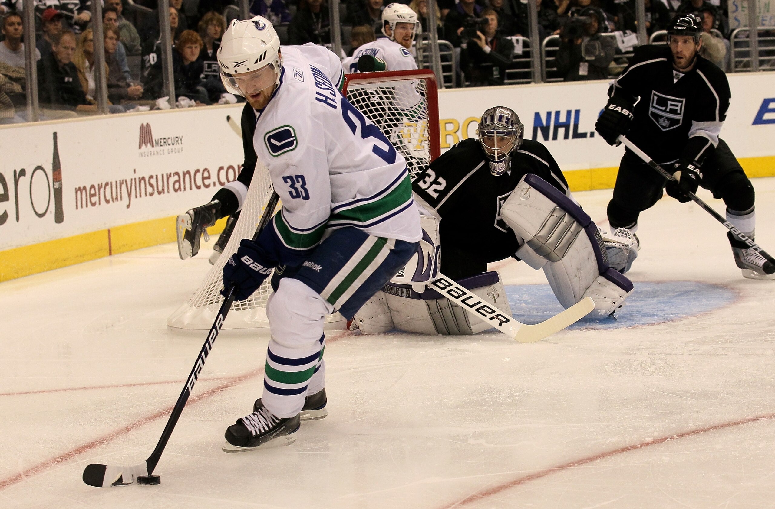 LOS ANGELES - APRIL 25: Henrik Sedin #33 of the Vancouver Canucks controls the puck in front goaltender Jonathan Quick #32 of the Los Angeles Kings during Game Six of the Western Conference Quarterfinals of the 2010 NHL Stanley Cup Playoffs on April 25, LOS ANGELES - APRIL 25: Henrik Sedin #33 of the Vancouver Canucks controls the puck in front goaltender Jonathan Quick #32 of the Los Angeles Kings during Game Six of the Western Conference Quarterfinals of the 2010 NHL Stanley Cup Playoffs on April 25,