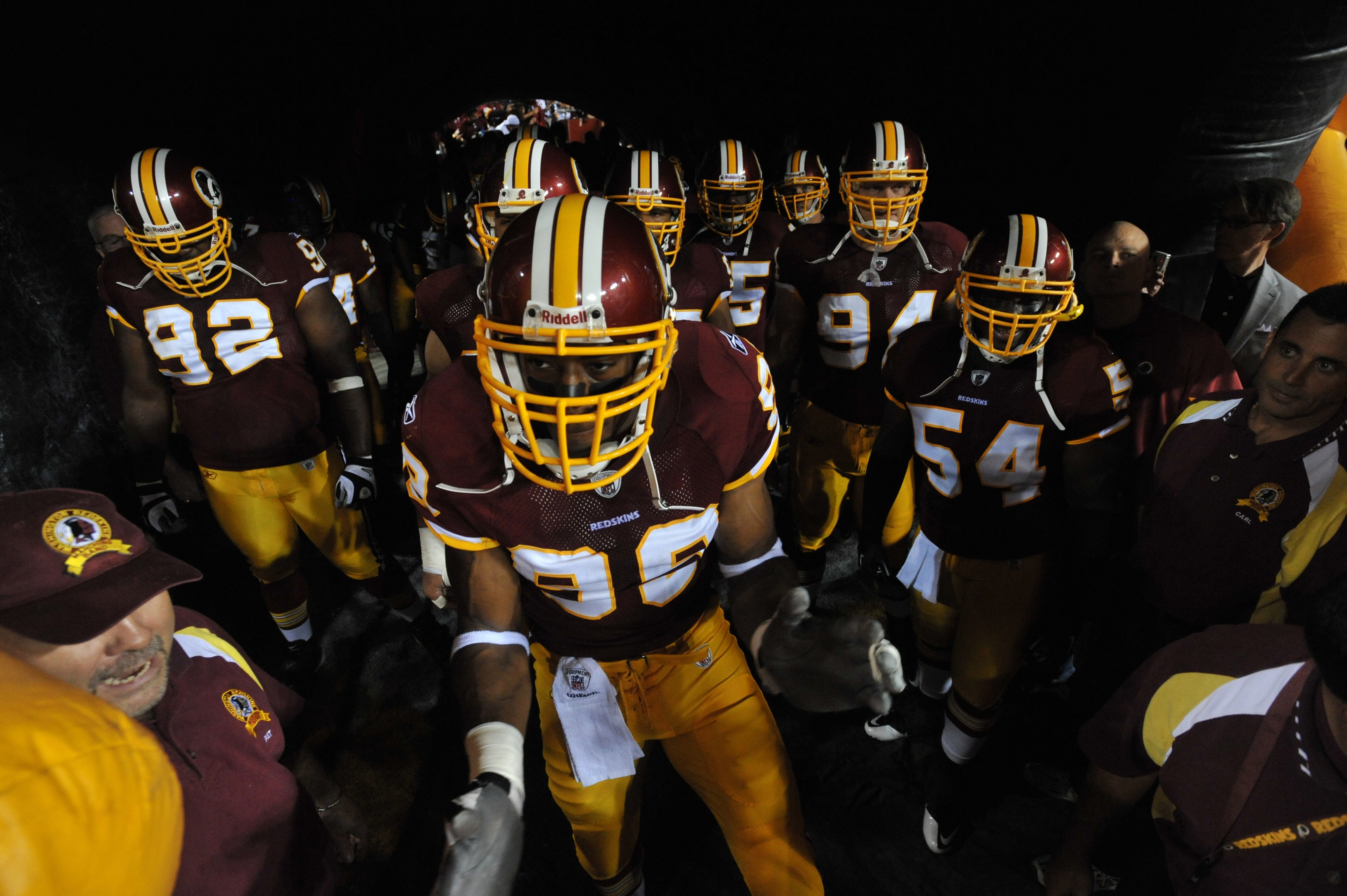 LANDOVER - SEPTEMBER 12:  The Washington Redskins prepare to run out onto the field before the NFL season opener against the Dallas Cowboys at FedExField on September 12, 2010 in Landover, Maryland. The Redskins defeated the Cowboys 13-7. (Photo by Larry