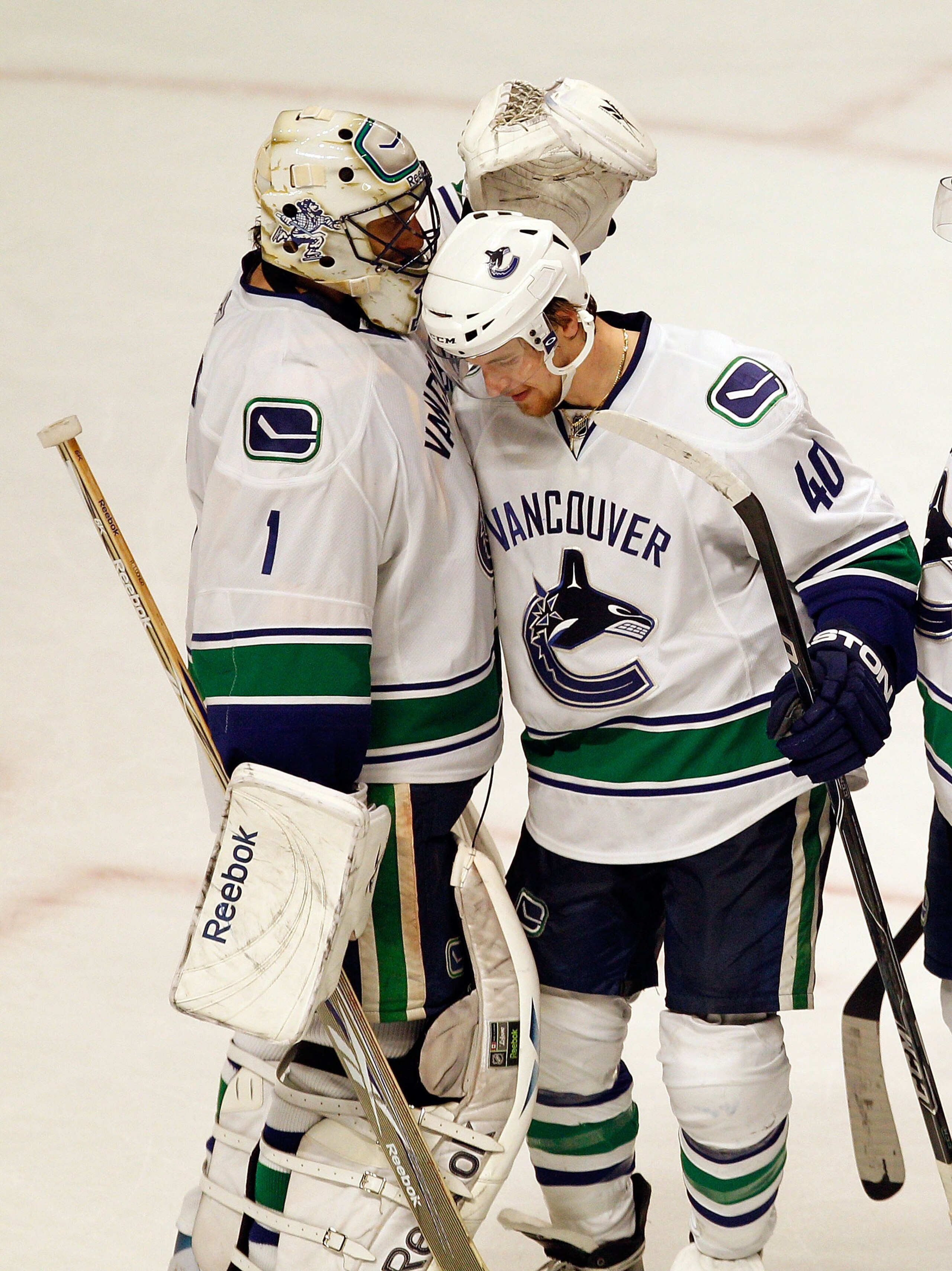 CHICAGO - MAY 09: Roberto Luongo #1 of the Vancouver Canucks is congratulated by Michael Grabner #40 after a win over the Chicago Blackhawks in Game Five of the Western Conference Semifinals during the 2010 NHL Stanley Cup Playoffs at United Center on May CHICAGO - MAY 09: Roberto Luongo #1 of the Vancouver Canucks is congratulated by Michael Grabner #40 after a win over the Chicago Blackhawks in Game Five of the Western Conference Semifinals during the 2010 NHL Stanley Cup Playoffs at United Center on May