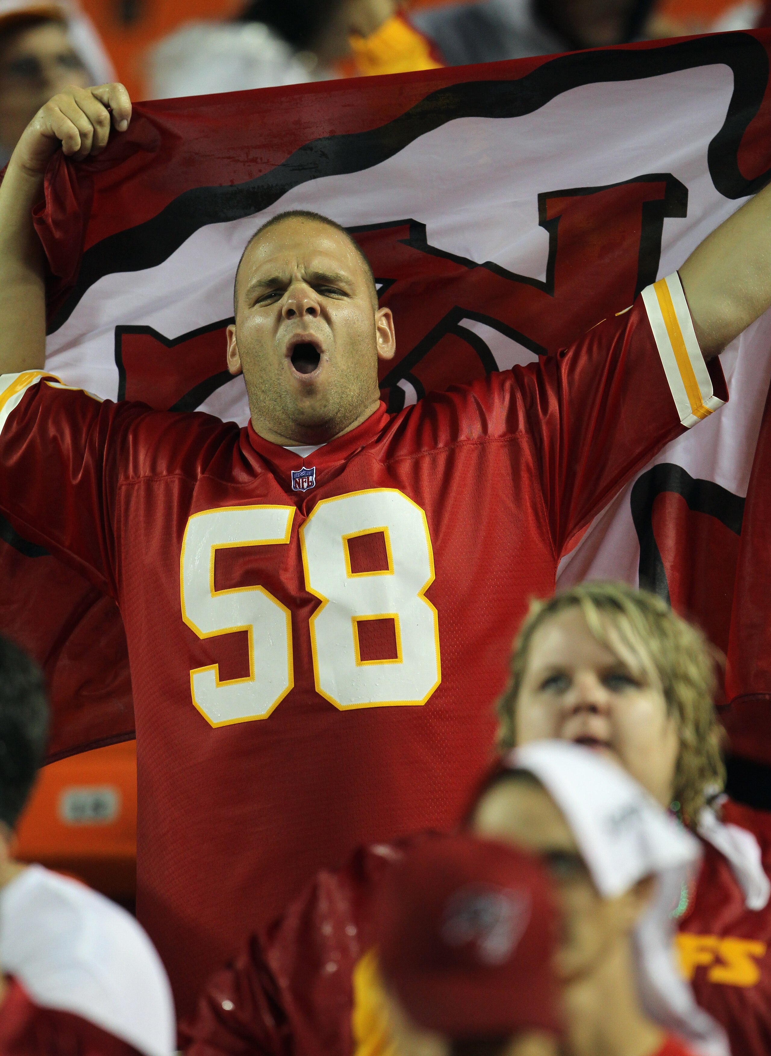 KANSAS CITY, MO - SEPTEMBER 13:  A Kansas City Chiefs fan cheers during the game against the San Diego Chargers on September 13, 2010 at Arrowhead Stadium in Kansas City, Missouri.  (Photo by Jamie Squire/Getty Images)