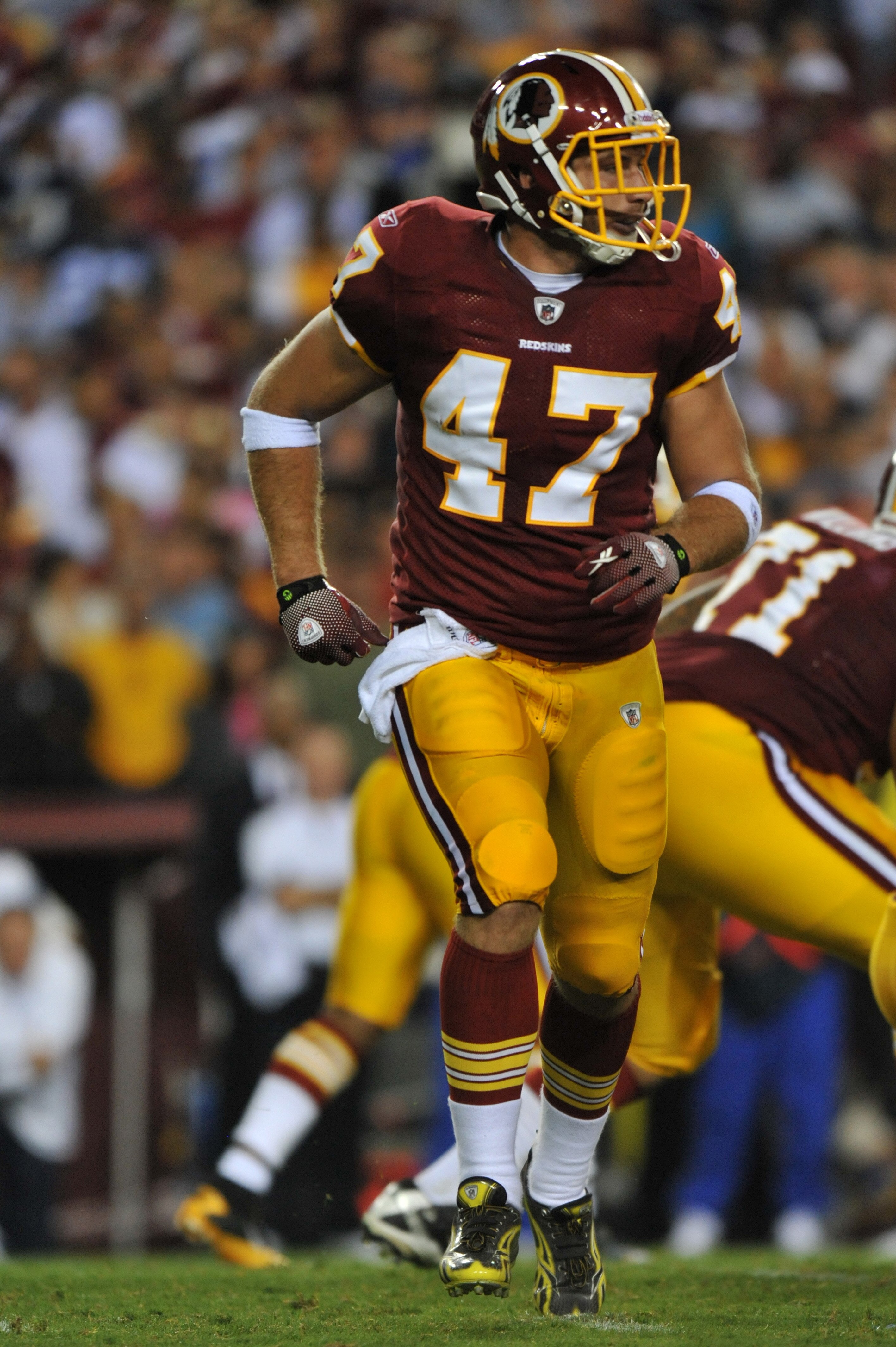 LANDOVER - SEPTEMBER 12:  Chris Cooley #47 of the Washington Redskins runs in the backfield during the NFL season opener against the Dallas Cowboys at FedExField on September 12, 2010 in Landover, Maryland. The Redskins defeated the Cowboys 13-7. (Photo b