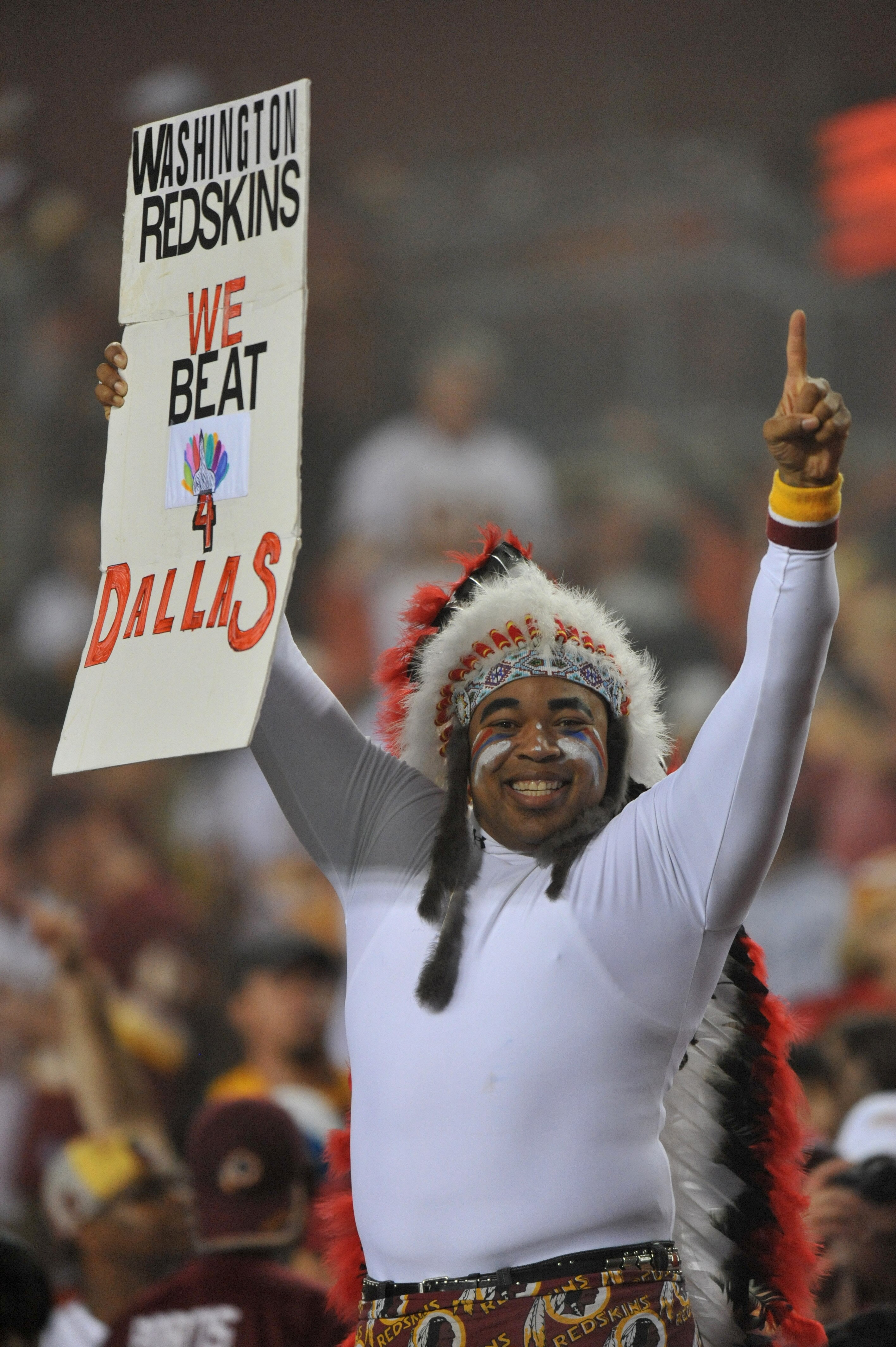 LANDOVER - SEPTEMBER 12:  A fan of the Washington Redskins cheers during the NFL season opener against the Dallas Cowboys at FedExField on September 12, 2010 in Landover, Maryland. The Redskins defeated the Cowboys 13-7. (Photo by Larry French/Getty Image