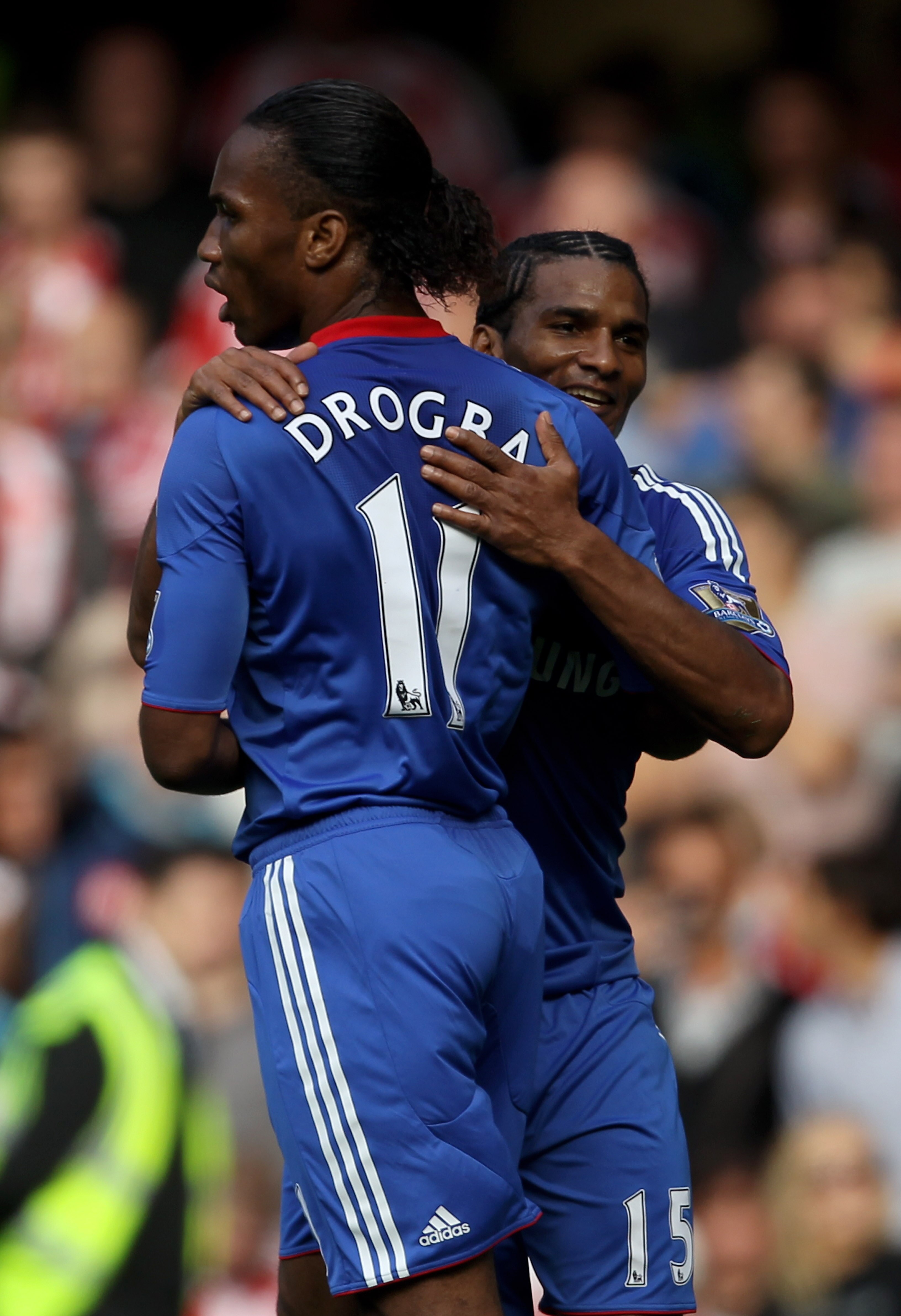 LONDON, ENGLAND - AUGUST 28:  Didier Drogba of Chelsea is congratulated by teammate Florent Malouda (R) after scoring his team's second goal from the penalty spot during the Barclays Premier League match between Chelsea and Stoke City at Stamford Bridge o