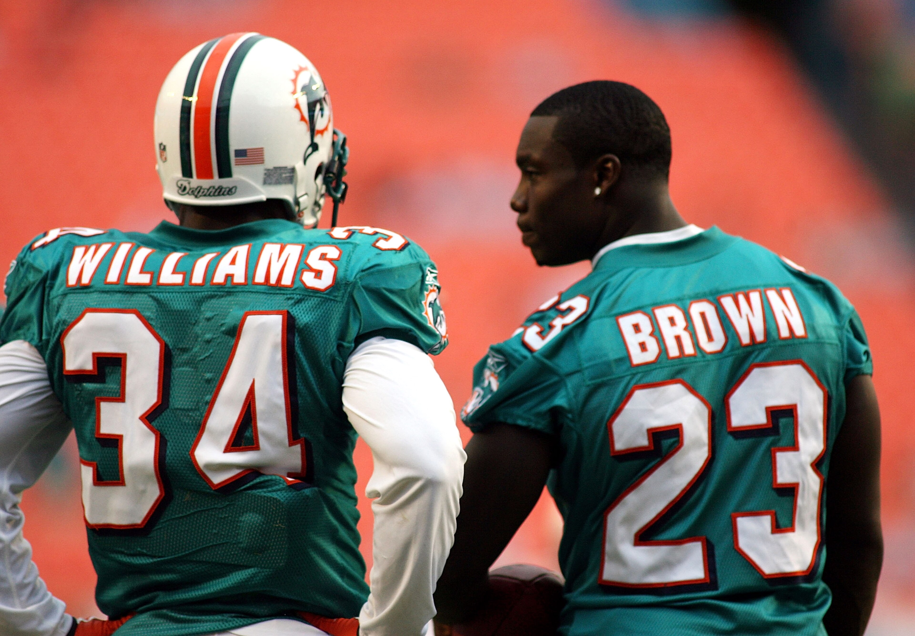 MIAMI - AUGUST 23: Running backs Ricky Williams #34 and Ronnie Brown #23 of the Miami Dolphins chat prior to a preseason game against the Kansas City Chiefs on August 23, 2008 at Dolphin Stadium in Miami, Florida.  (Photo by Marc Serota/Getty Images)