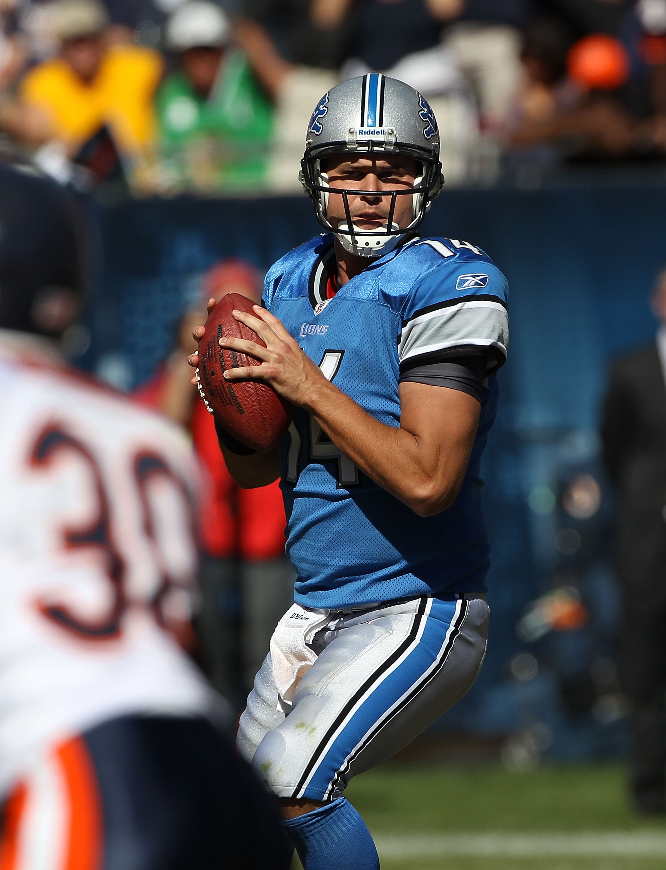 CHICAGO - SEPTEMBER 12: Shaun Hill #14 of the Detroit Lions looks for a receiver against the Chicago Bears during the NFL season opening game at Soldier Field on September 12, 2010 in Chicago, Illinois. The Bears defeated the Lions 19-14. (Photo by Jonath