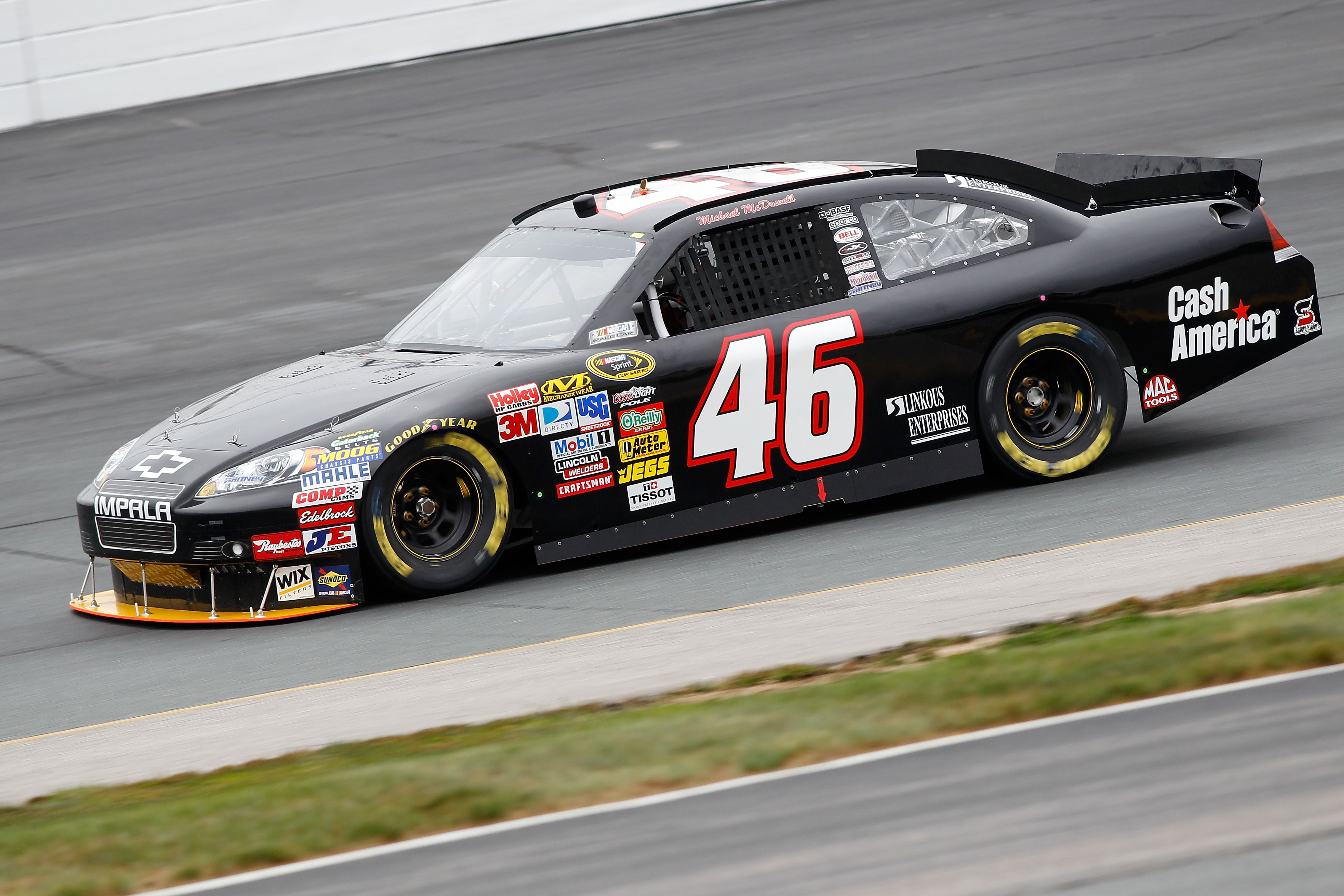 LOUDON, NH - SEPTEMBER 17:  Michael McDowell, driver of the #46 Cash America Dodge, drives on track during practice for the NASCAR Sprint Cup Series Sylvania 300 at New Hampshire Motor Speedway on September 17, 2010 in Loudon, New Hampshire.  (Photo by To