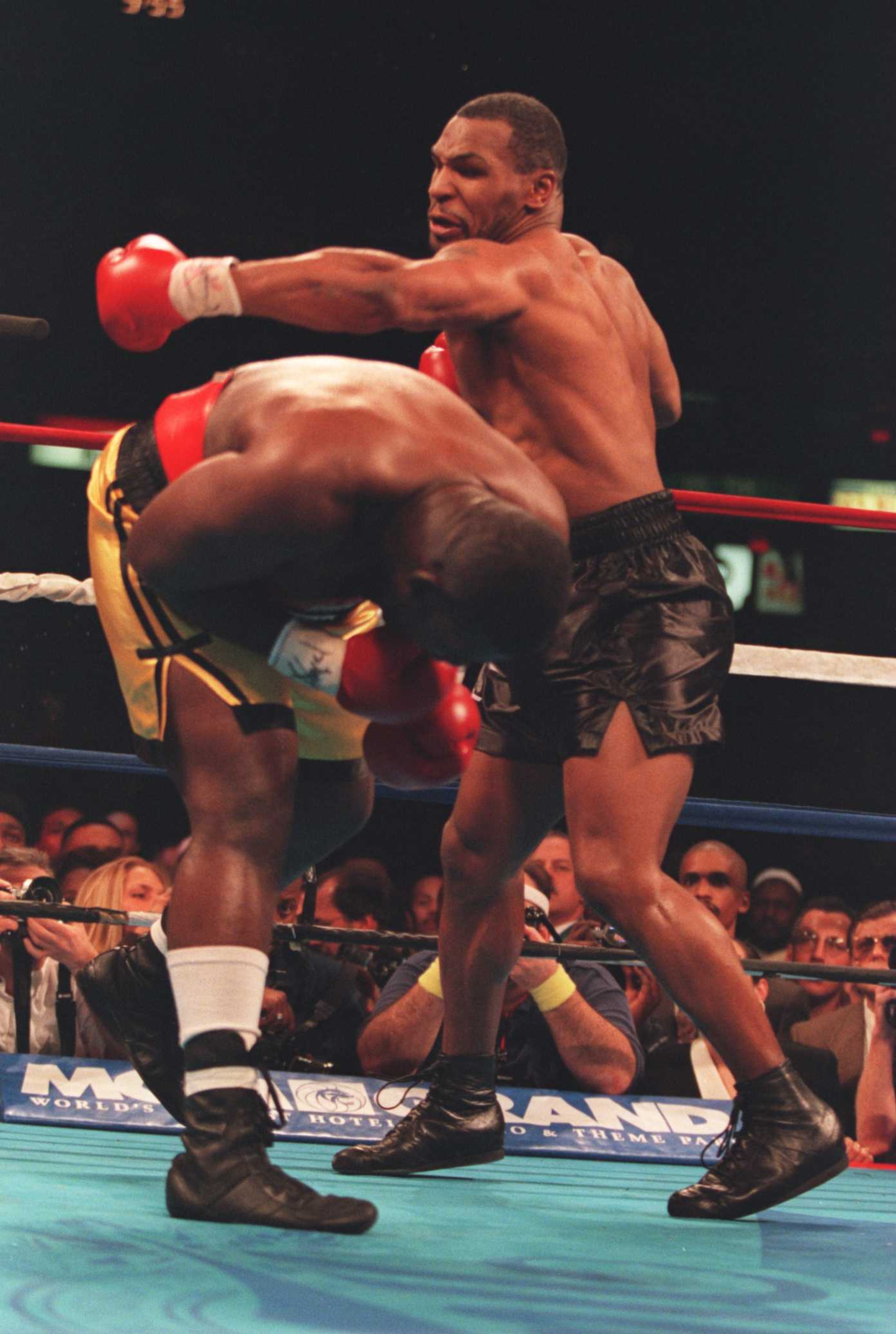 16 DEC 1995: MIKE TYSON SWINGS AT BUSTER MATHIS JNR ON HIS WAY TO KNOCKING HIM OUT IN THE THIRD ROUND OF THEIR FIGHT AT THE CORESTATES SPECTRUM IN PHILADELPHIA, PENNSYLVANIA. Mandatory Credit: Simon Bruty/ALLSPORT 16 DEC 1995: MIKE TYSON SWINGS AT BUSTER MATHIS JNR ON HIS WAY TO KNOCKING HIM OUT IN THE THIRD ROUND OF THEIR FIGHT AT THE CORESTATES SPECTRUM IN PHILADELPHIA, PENNSYLVANIA. Mandatory Credit: Simon Bruty/ALLSPORT