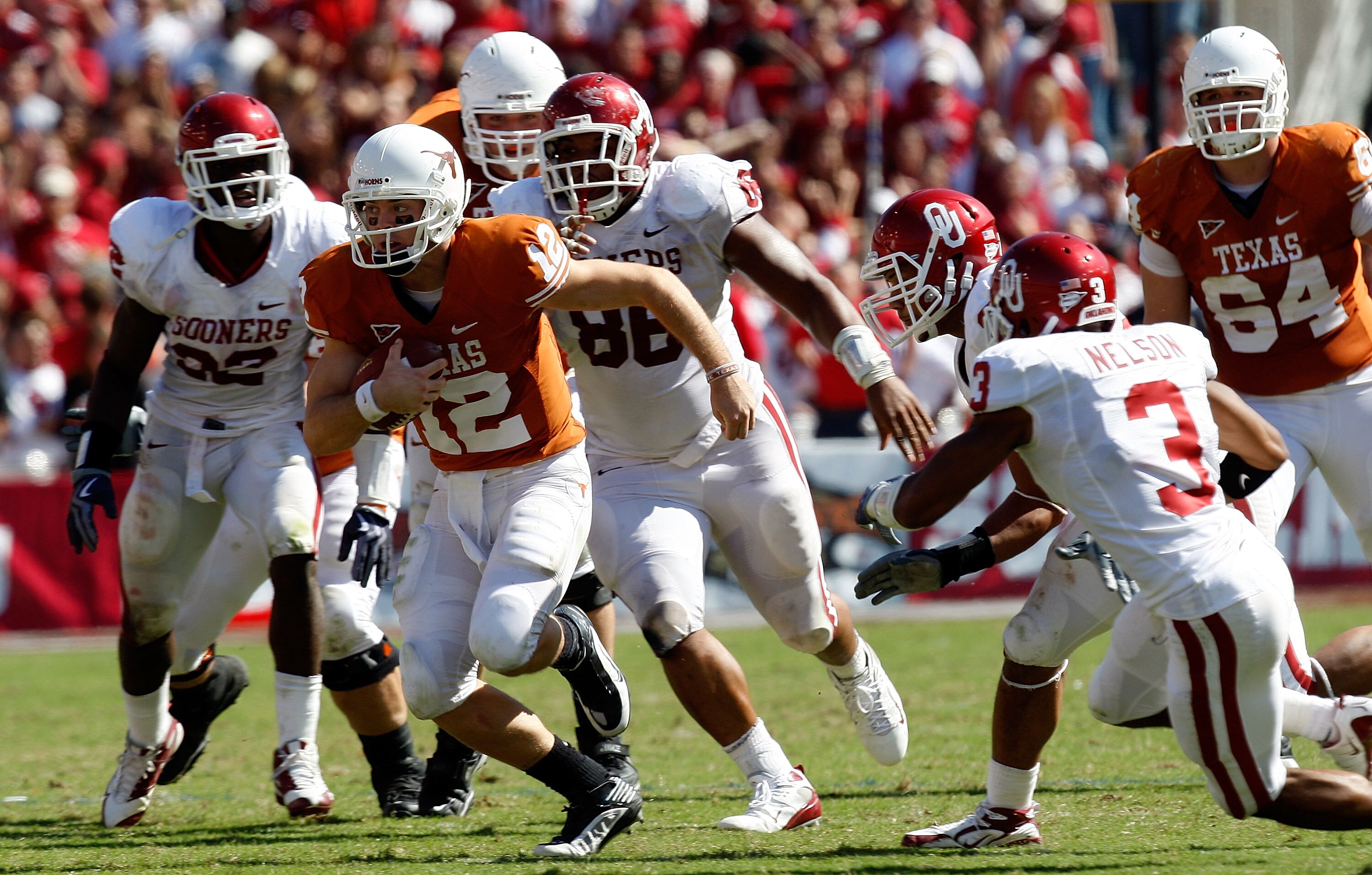 DALLAS - OCTOBER 17:  Quarterback Colt McCoy #12 of the Texas Longhorns runs the ball against the Oklahoma Sooners at Cotton Bowl on October 17, 2009 in Dallas, Texas.  (Photo by Ronald Martinez/Getty Images)