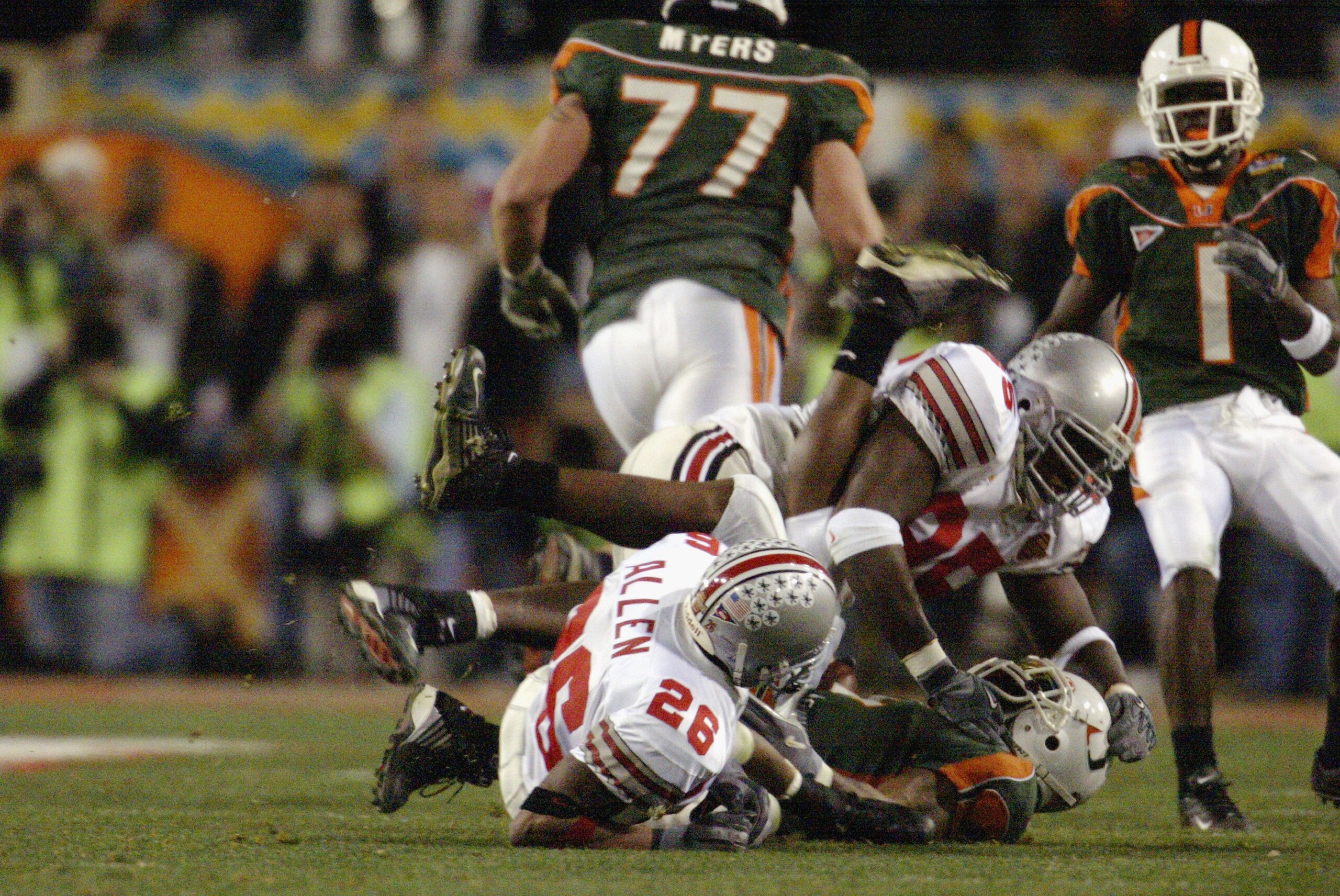TEMPE, ARIZONA - JANUARY 3:  Running back Willis McGahee #2 of the University of Miami Hurricanes suffers a devastating knee injury as he is tackled by Safety Will Allen #25 and Defensive tackle David Thompson #95 of Ohio State Buckeyes during the Tostito