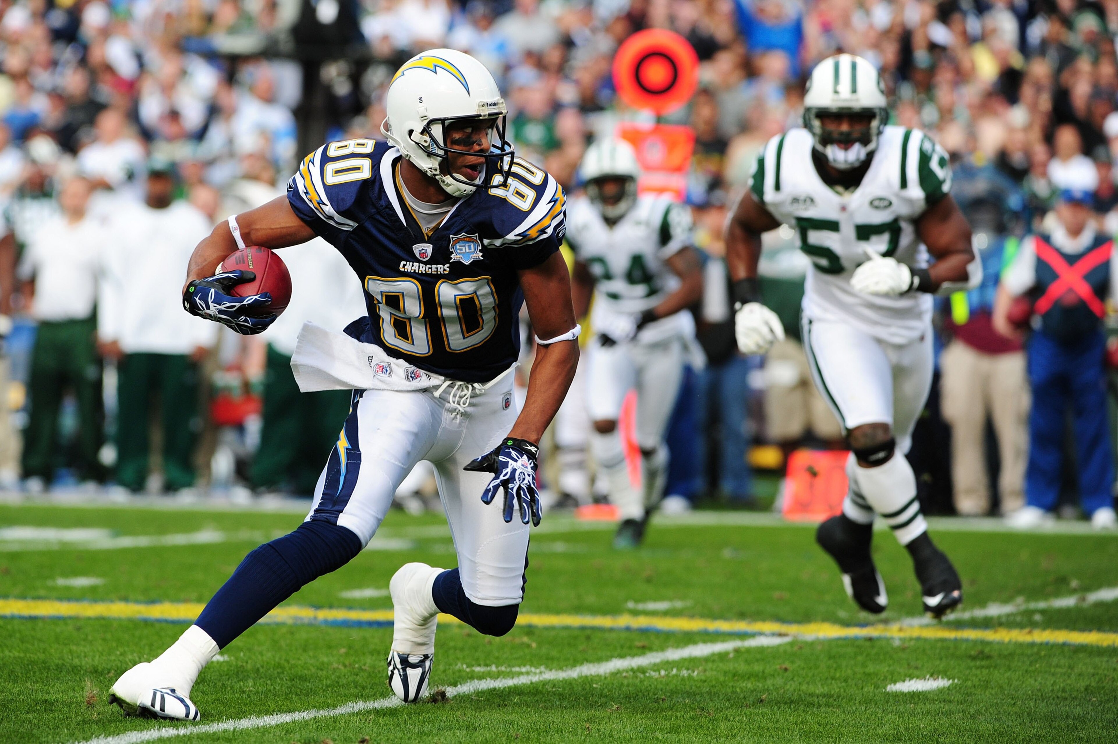 SAN DIEGO - JANUARY 17: Wide receiver Malcom Floyd #80 of the San Diego Chargers runs with the ball after a catch against the New York Jets during AFC Divisional Playoff Game at Qualcomm Stadium on January 17, 2010 in San Diego, California. (Photo by R SAN DIEGO - JANUARY 17: Wide receiver Malcom Floyd #80 of the San Diego Chargers runs with the ball after a catch against the New York Jets during AFC Divisional Playoff Game at Qualcomm Stadium on January 17, 2010 in San Diego, California. (Photo by R