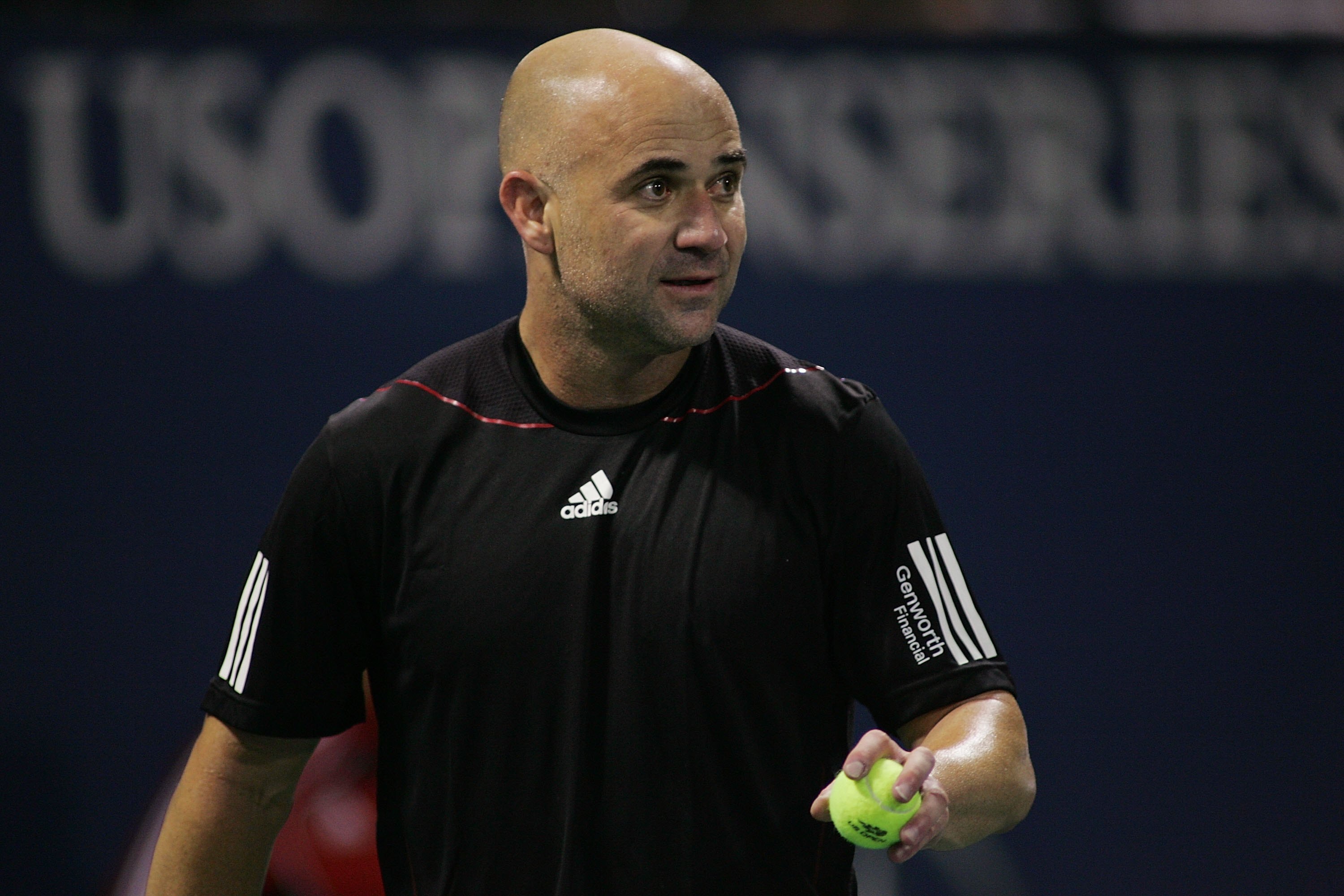LOS ANGELES, CA - JULY 24:  Andre Agassi serves against John McEnroe during the Stars Under the Stars gala on July 24, 2010 at the Los Angeles Tennis Center in Los Angeles, California.  Andre Agassi defeated John McEnroe 6-4, 6-2.  (Photo by Jeff Golden/G