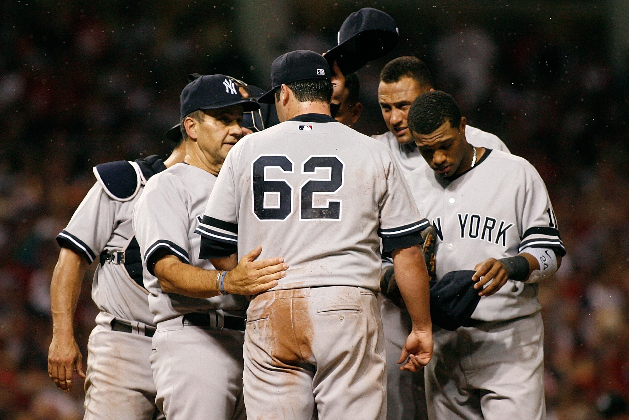 CLEVELAND - OCTOBER 05: Gnats (bugs) swarn the mound as manager Joe Torre #6 of the New York Yankees talks with relief pitcher Joba Chamberlain #62 as his teammates try to swat the insects away against the Cleveland Indians during Game Two of the America CLEVELAND - OCTOBER 05: Gnats (bugs) swarn the mound as manager Joe Torre #6 of the New York Yankees talks with relief pitcher Joba Chamberlain #62 as his teammates try to swat the insects away against the Cleveland Indians during Game Two of the America