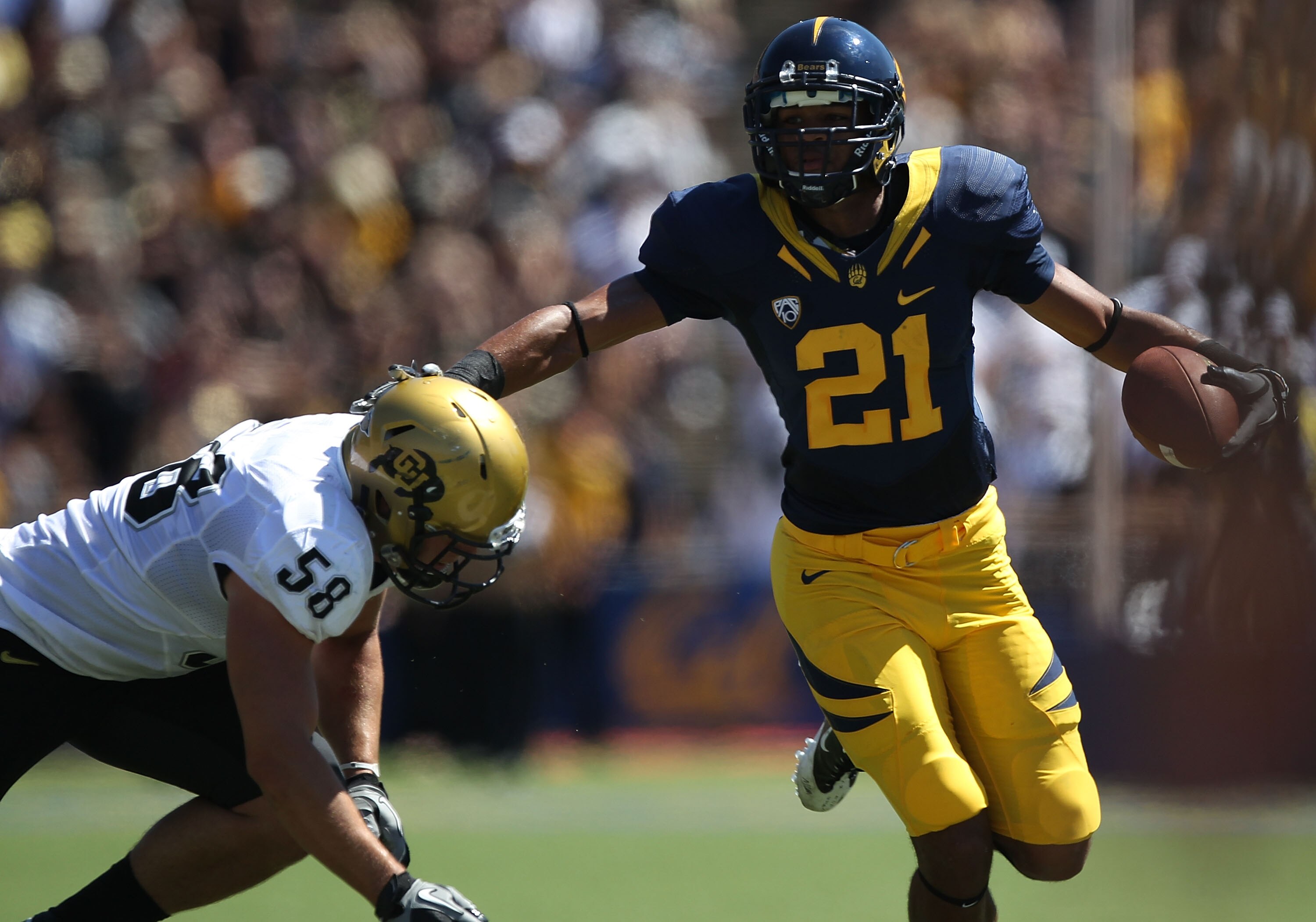 BERKELEY, CA - SEPTEMBER 11: Keenan Allen #21 of the California Golden Bears runs against Tyler Ahles #58 of the Colorado Buffaloes at California Memorial Stadium on September 11, 2010 in Berkeley, California.  (Photo by Jed Jacobsohn/Getty Images)