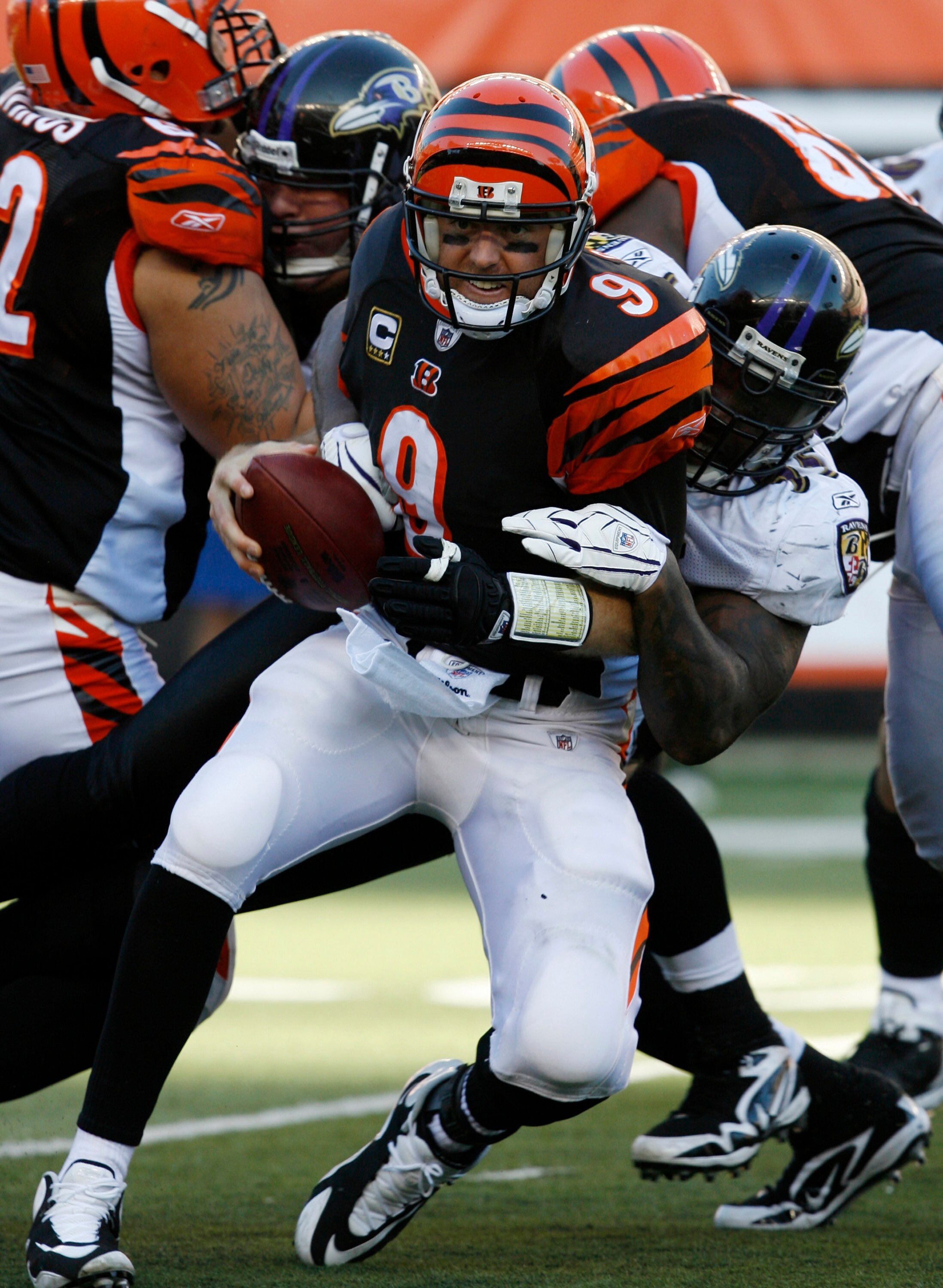 CINCINNATI - NOVEMBER 8: Carson Palmer #9 of the Cincinnati Bengals is sacked by Terrell Suggs #55 of the Baltimore Ravens in their NFL game at Paul Brown Stadium November 8, 2009 in Cincinnati, Ohio.    (Photo by John Sommers II/Getty Images)