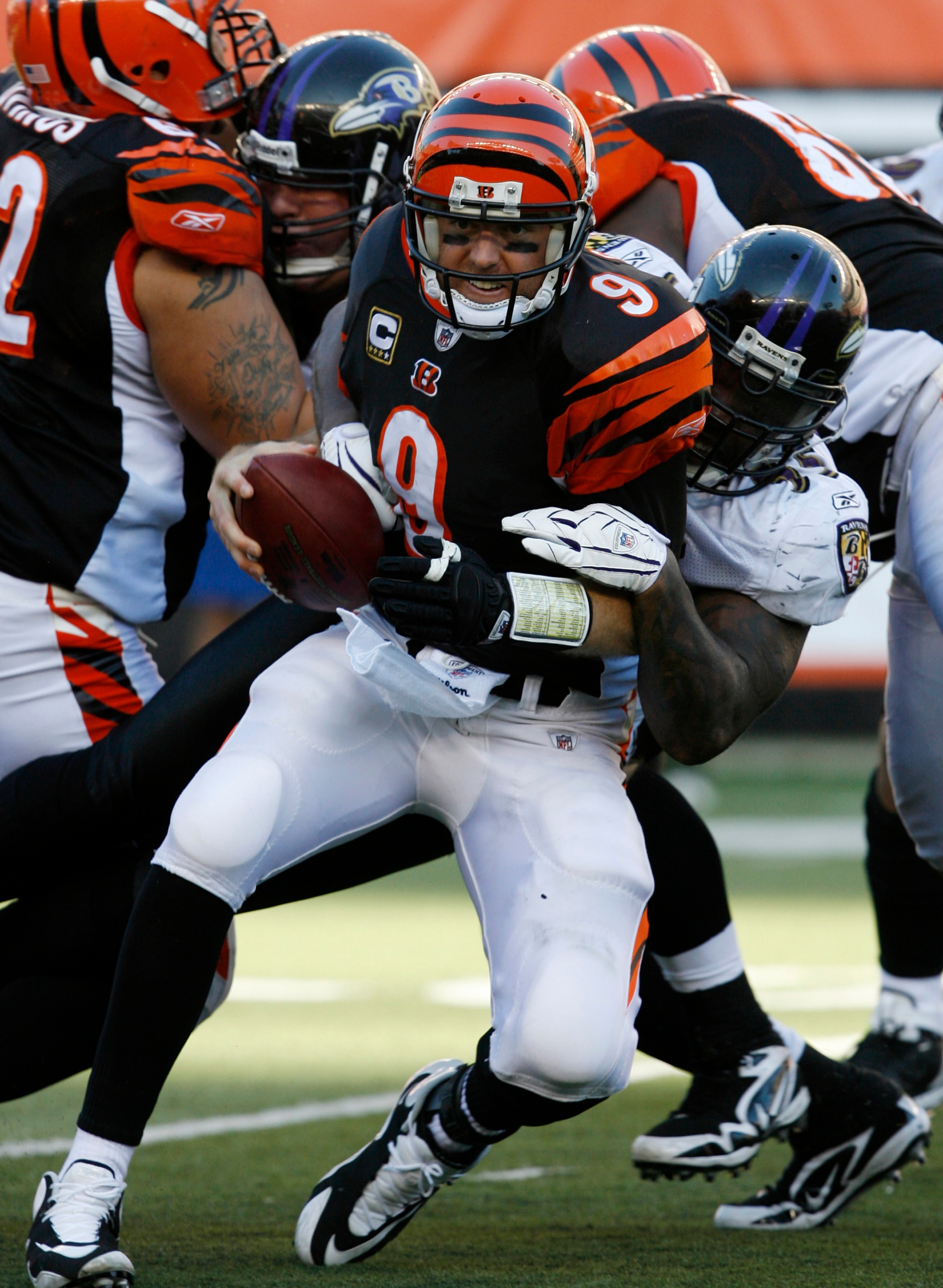 CINCINNATI - NOVEMBER 8: Carson Palmer #9 of the Cincinnati Bengals is sacked by Terrell Suggs #55 of the Baltimore Ravens in their NFL game at Paul Brown Stadium November 8, 2009 in Cincinnati, Ohio.    (Photo by John Sommers II/Getty Images)