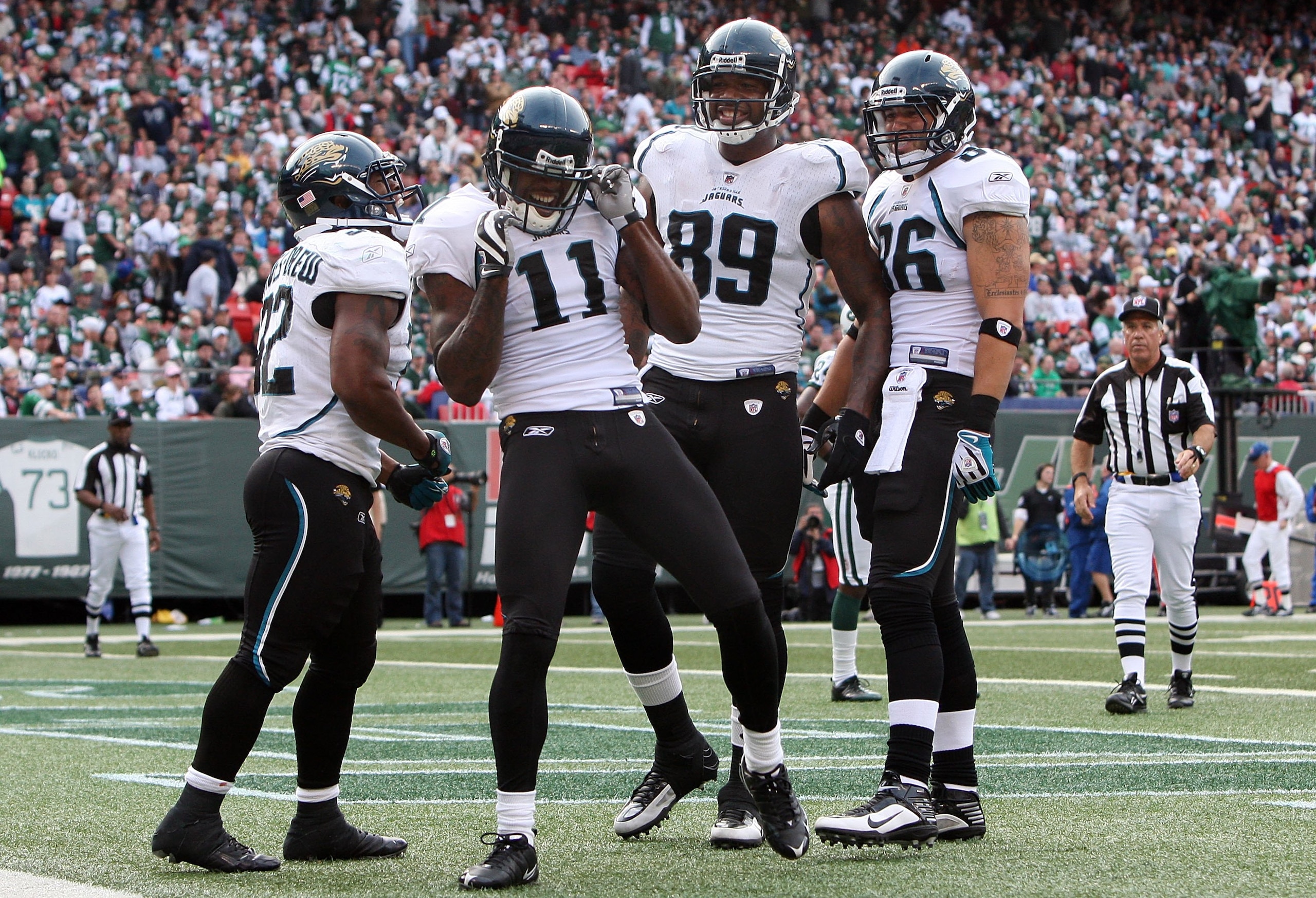EAST RUTHERFORD, NJ - NOVEMBER 15:  Mike Sims-Walker #11 of the Jacksonville Jaguars celebrates his touchdown against the New York Jets in the first half on November 15, 2009 at Giants Stadium in East Rutherford, New Jersey.  (Photo by Jim McIsaac/Getty I