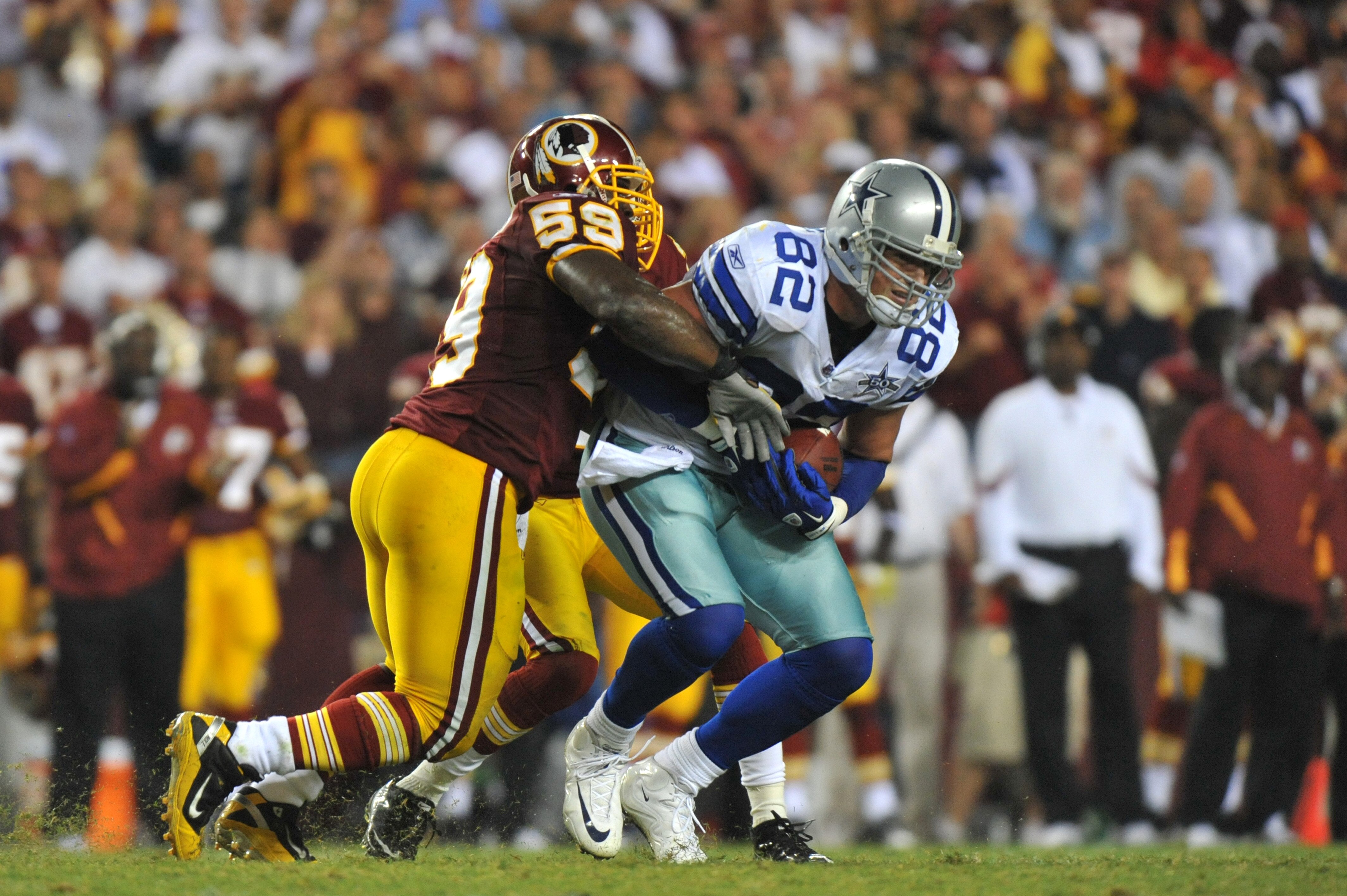 LANDOVER - SEPTEMBER 12:  London Fletcher #59 of the Washington Redskins tackles Jason Witten #82 of the Dallas Cowboys during the NFL season opener at FedExField on September 12, 2010 in Landover, Maryland. The Redskins defeated the Cowboys 13-7. (Photo 